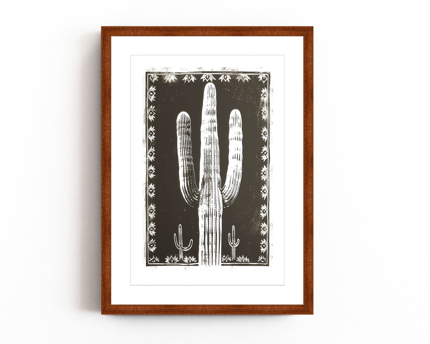 Southwestern cactus art print featuring a bold black and white desert landscape with a large saguaro cactus framed by intricate tribal patterns, perfect for modern southwestern-inspired decor.
