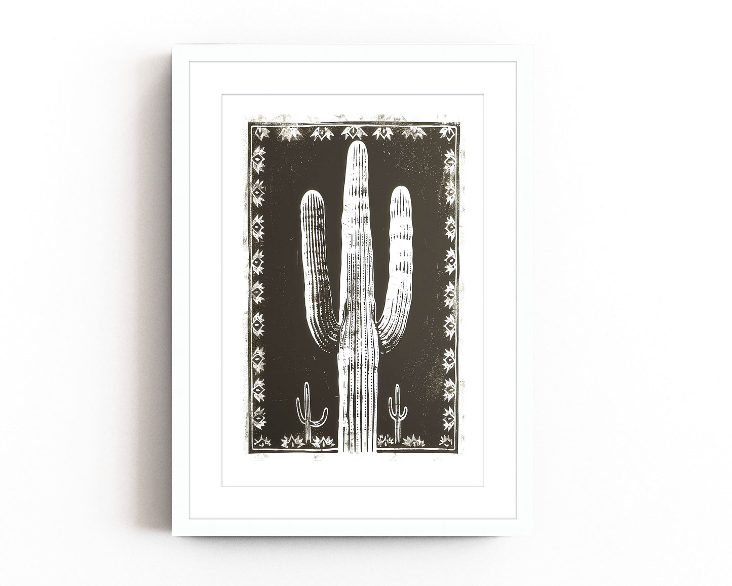Southwestern cactus art print featuring a bold black and white desert landscape with a large saguaro cactus framed by intricate tribal patterns, perfect for modern southwestern-inspired decor.