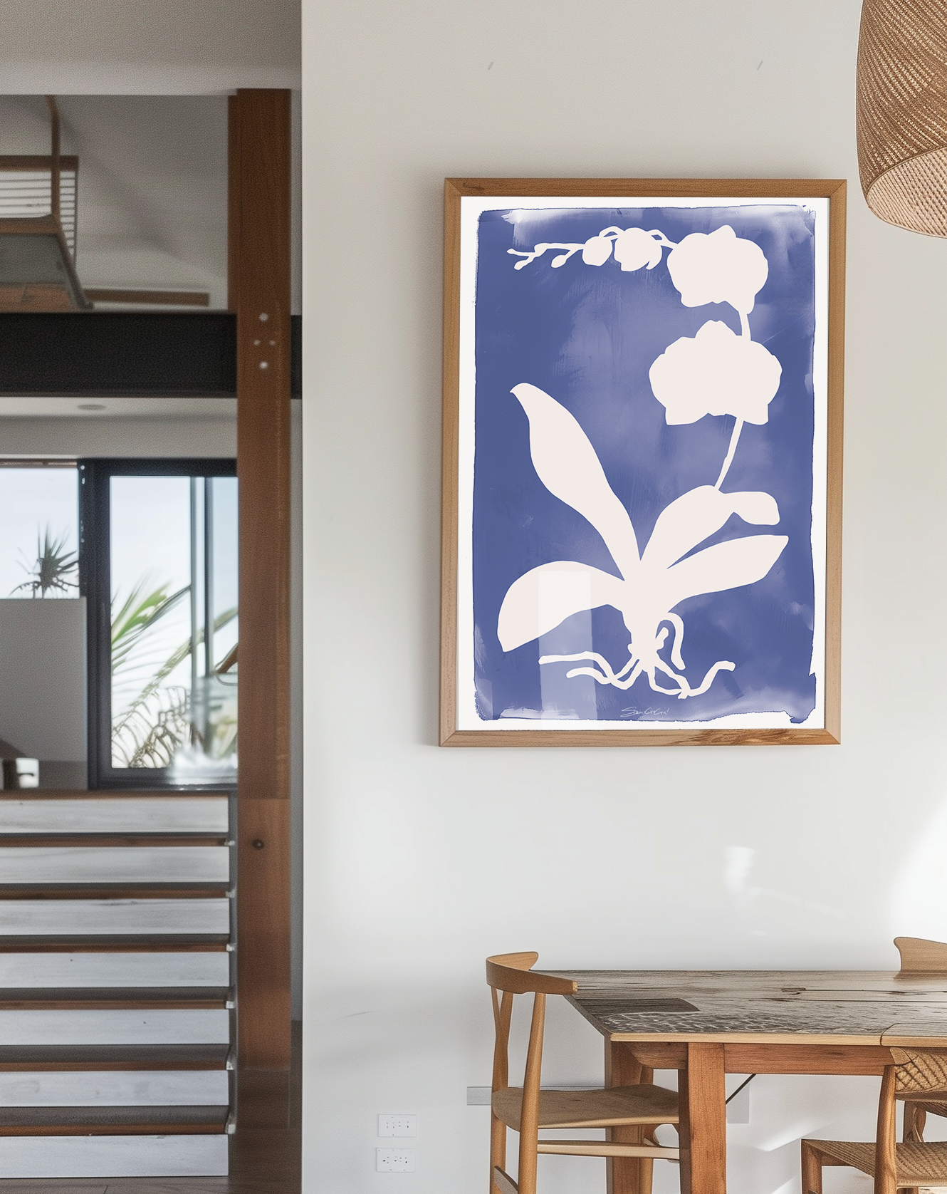 Minimalist orchid leaf and flower silhouette in white on a vibrant blue background, creating a contemporary botanical art print for home decor.