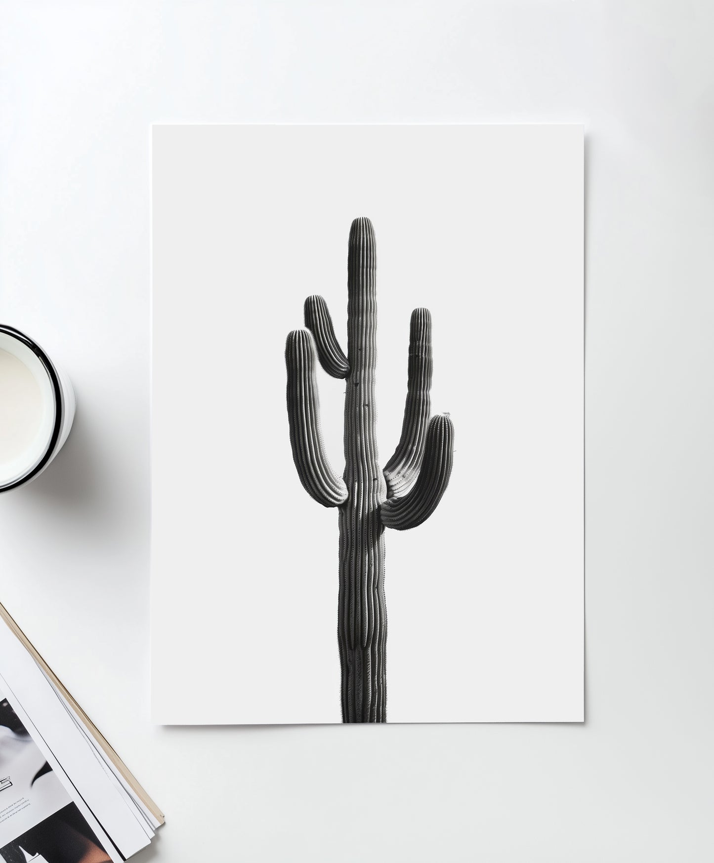 Black and white cactus art print featuring a minimalist design with a tall desert cactus on a plain white background. Perfect for southwestern-inspired decor and modern cactus wall art.