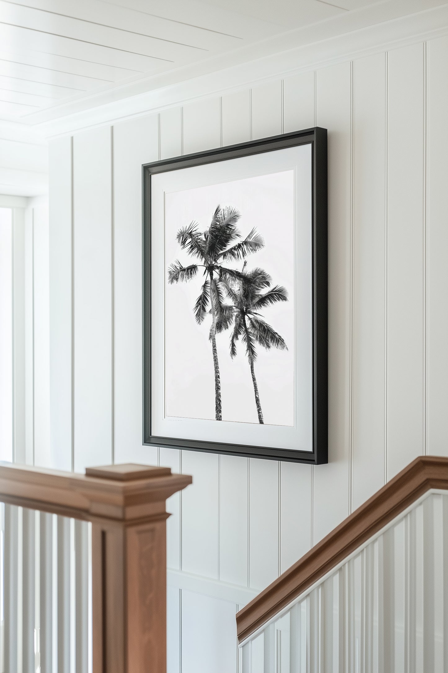 Monochrome black and white photograph of two palm trees set against a minimal sky, ideal for tropical-inspired modern home decor and nature wall art.