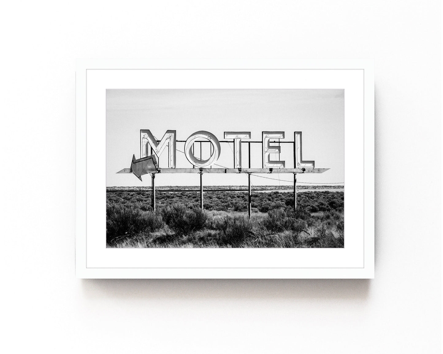 Vintage motel sign art print in black and white featuring a nostalgic roadside sign. Perfect for retro roadside decor, western-inspired art, and vintage wall photography