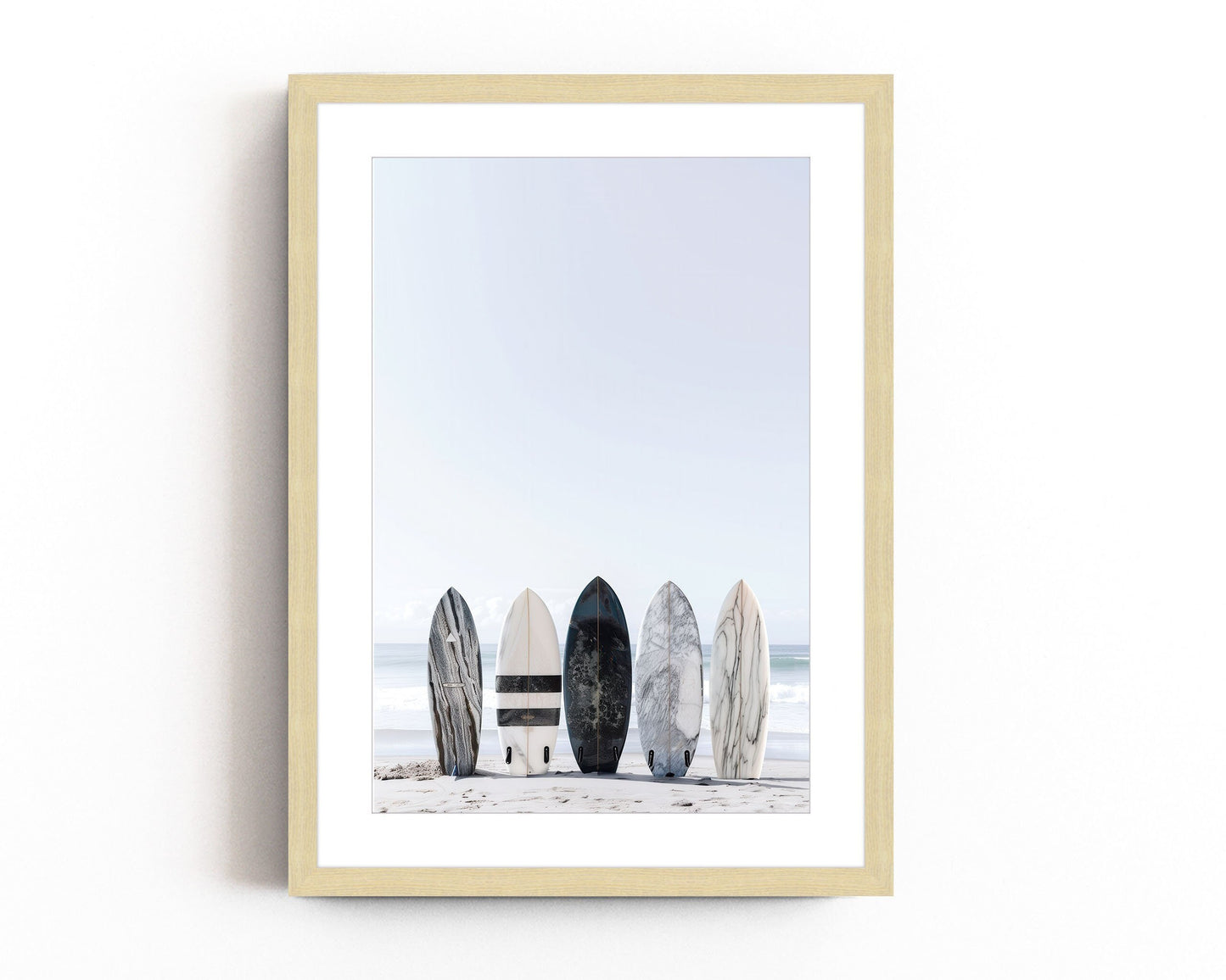 Black and white surfboard art print featuring a minimalist design with a lone surfboard on a beach against the ocean. Perfect for coastal beach decor, surf-inspired home decor, and modern coastal wall art