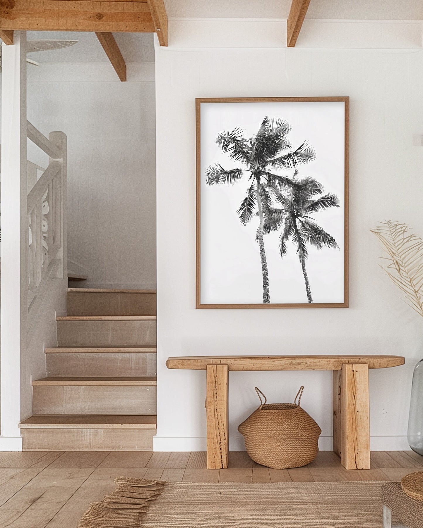 Monochrome black and white photograph of two palm trees set against a minimal sky, ideal for tropical-inspired modern home decor and nature wall art, shown in a beach house as wall art decor