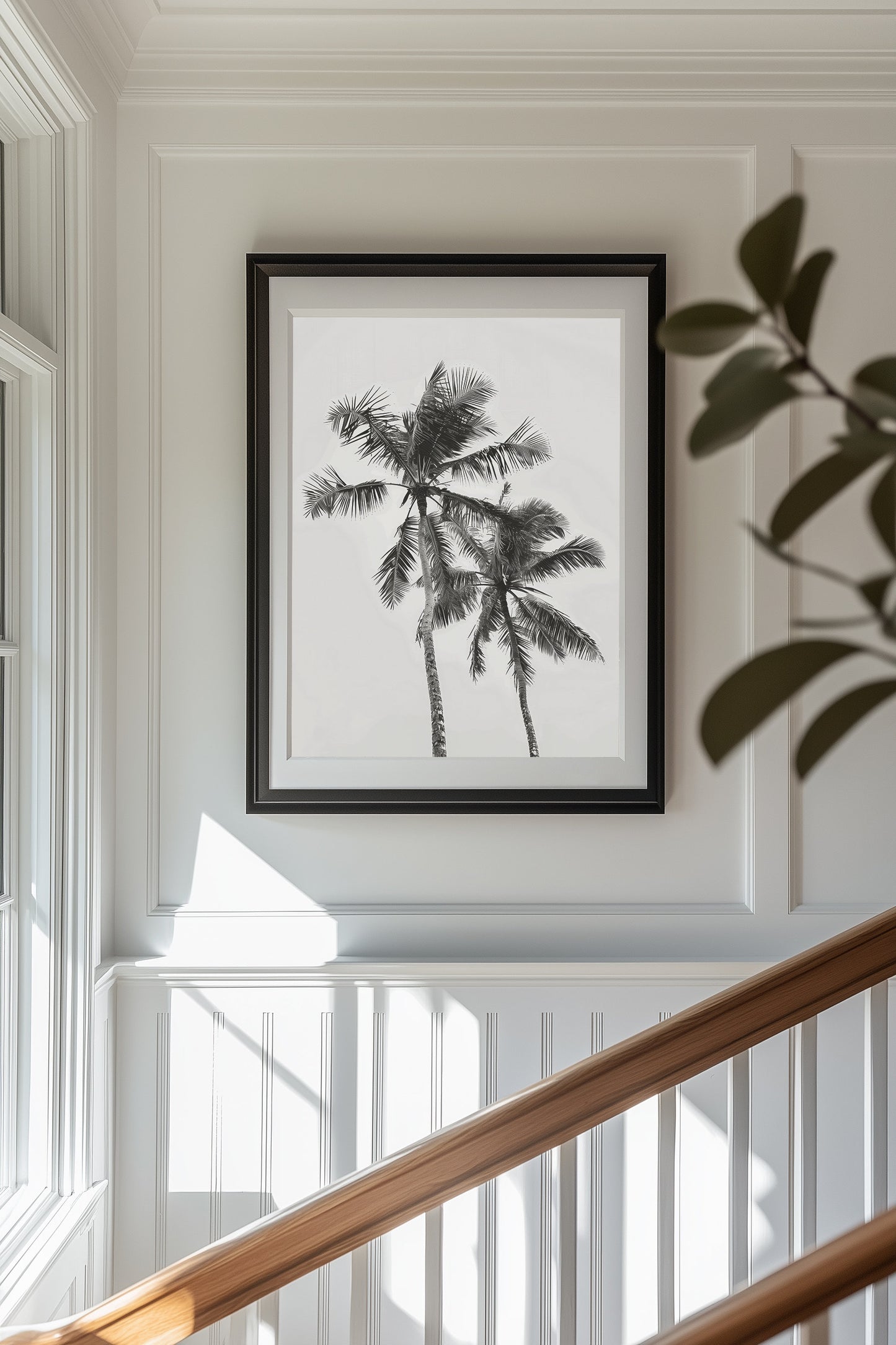 Monochrome black and white photograph of two palm trees set against a minimal sky, ideal for tropical-inspired modern home decor and nature wall art.