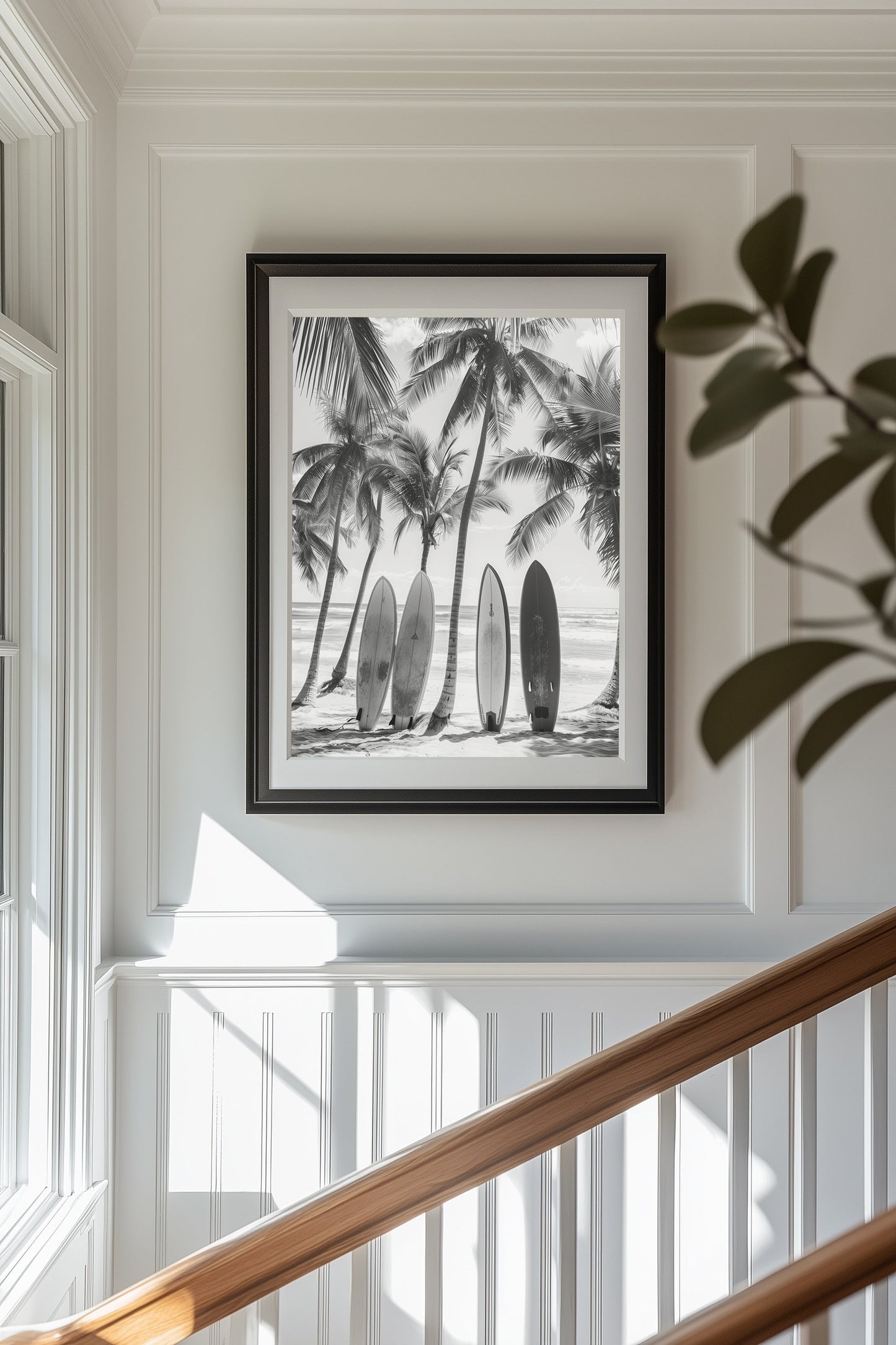 Black and white coastal wall art featuring surfboards lined up against palm trees on a tropical beach, capturing the vintage beach photography style and minimalist coastal decor.