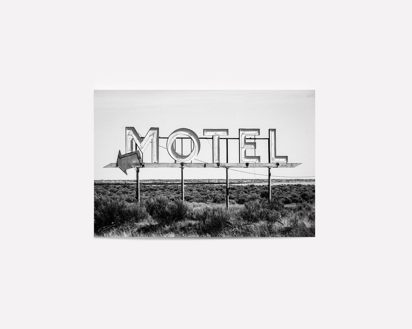 Vintage motel sign art print in black and white featuring a nostalgic roadside sign. Perfect for retro roadside decor, western-inspired art, and vintage wall photography
