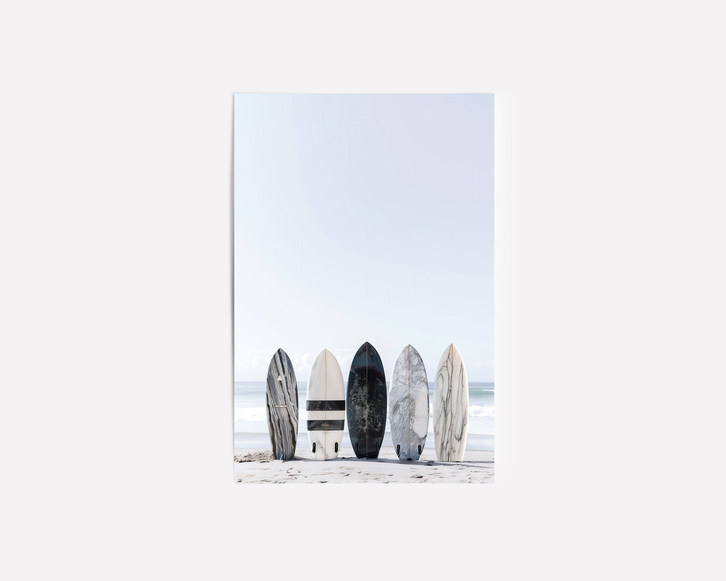 Black and white surfboard art print featuring a minimalist design with a lone surfboard on a beach against the ocean. Perfect for coastal beach decor, surf-inspired home decor, and modern coastal wall art
