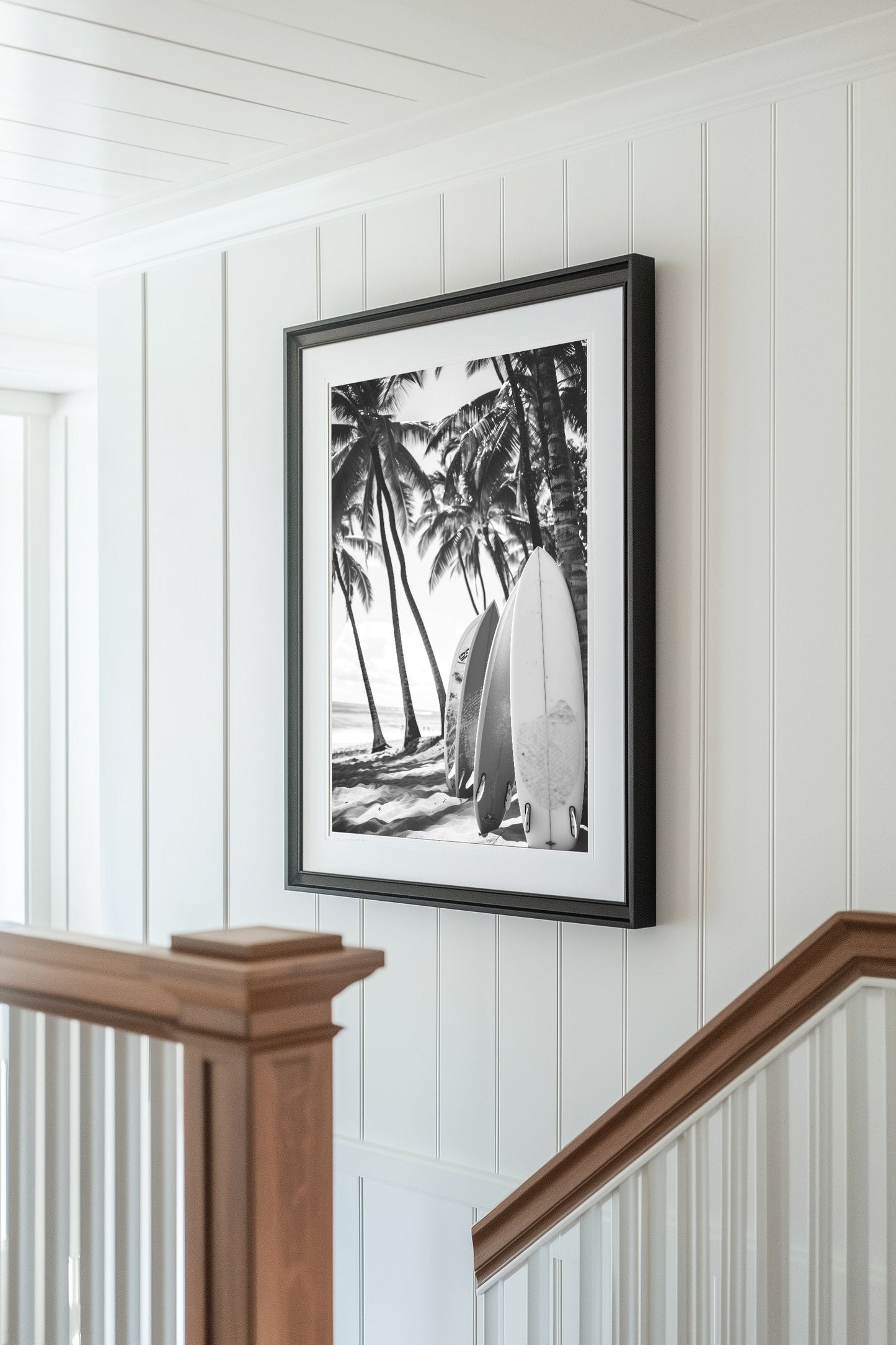 Black and white surfboard art print featuring surfboards resting on a beach under palm trees, capturing the essence of coastal living.