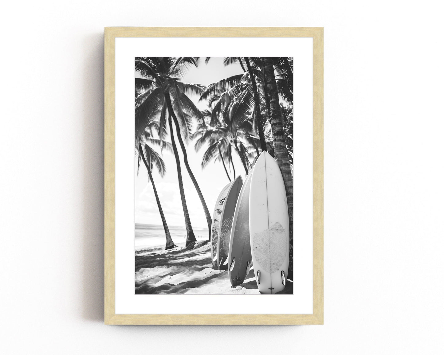 Black and white surfboard art print featuring surfboards resting on a beach under palm trees, capturing the essence of coastal living.