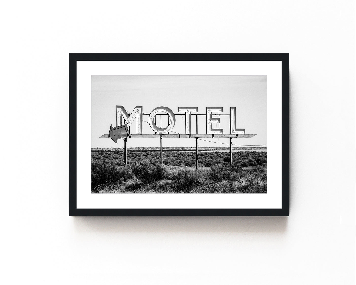 Vintage motel sign art print in black and white featuring a nostalgic roadside sign. Perfect for retro roadside decor, western-inspired art, and vintage wall photography