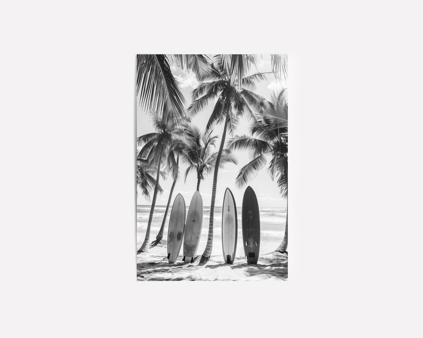 Black and white coastal wall art featuring surfboards lined up against palm trees on a tropical beach, capturing the vintage beach photography style and minimalist coastal decor.