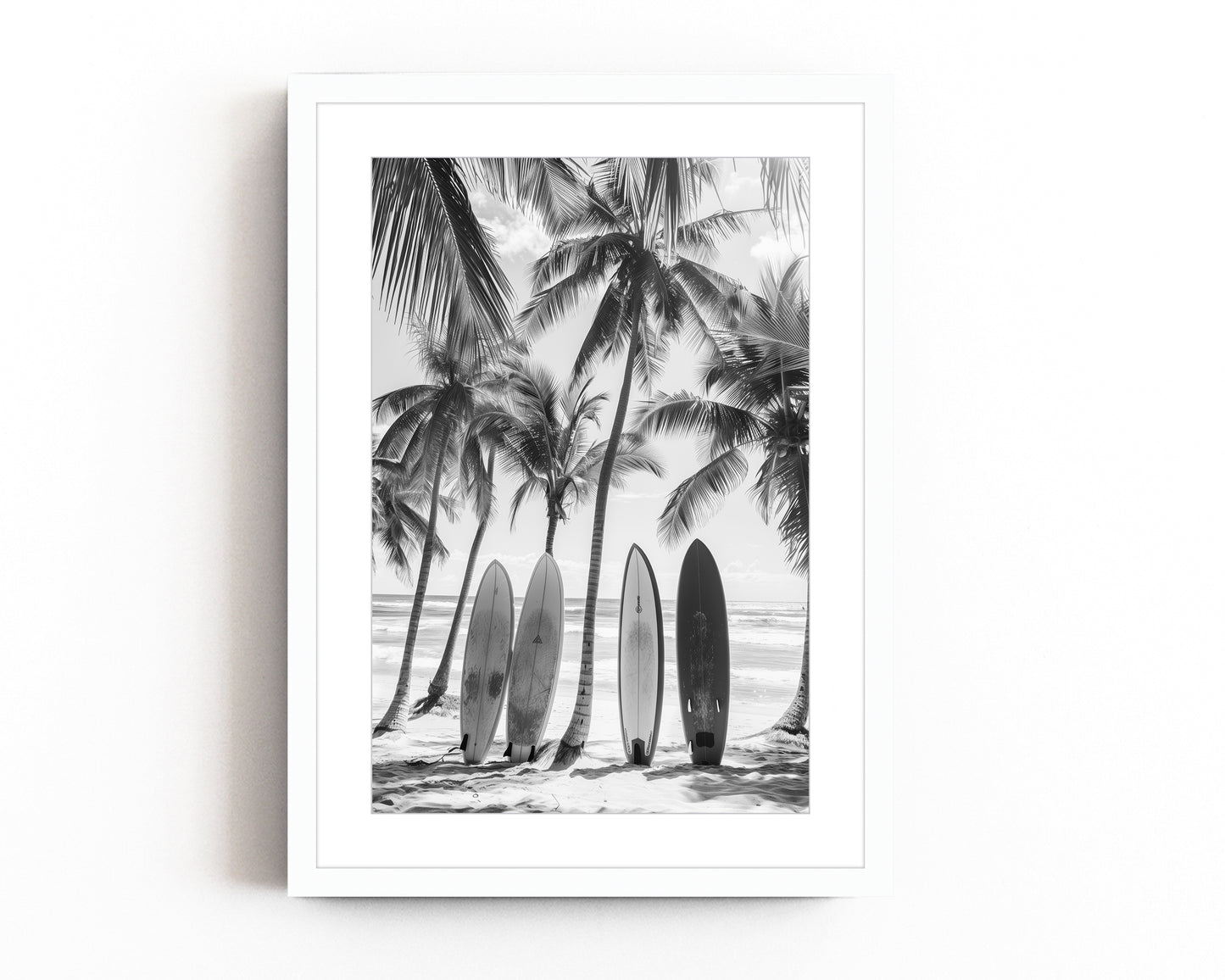 Black and white coastal wall art featuring surfboards lined up against palm trees on a tropical beach, capturing the vintage beach photography style and minimalist coastal decor.