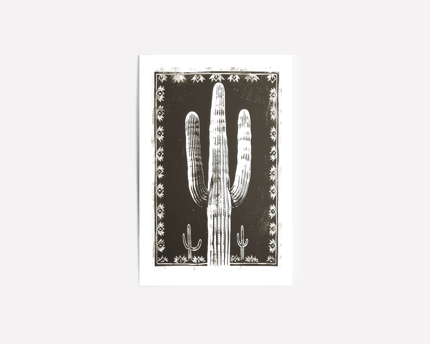 Southwestern cactus art print featuring a bold black and white desert landscape with a large saguaro cactus framed by intricate tribal patterns, perfect for modern southwestern-inspired decor.