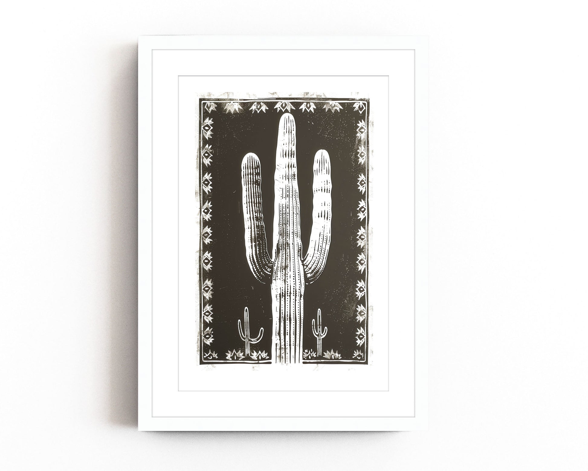 Southwestern cactus art print featuring a bold black and white desert landscape with a large saguaro cactus framed by intricate tribal patterns, perfect for modern southwestern-inspired decor.