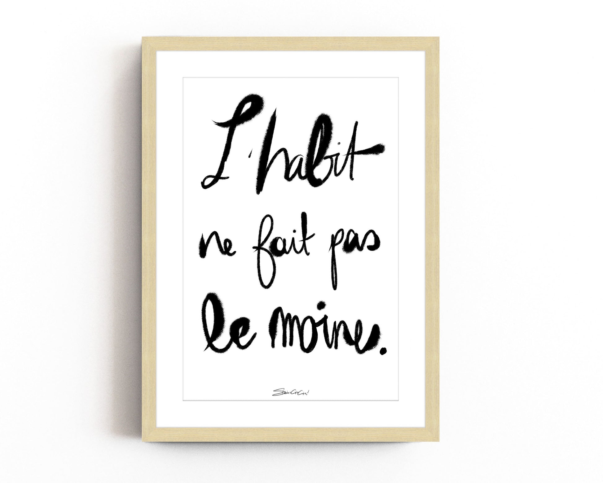 French typography print with “L’habit ne fait pas le moine” phrase in modern calligraphy style, black and white minimalist wall art.