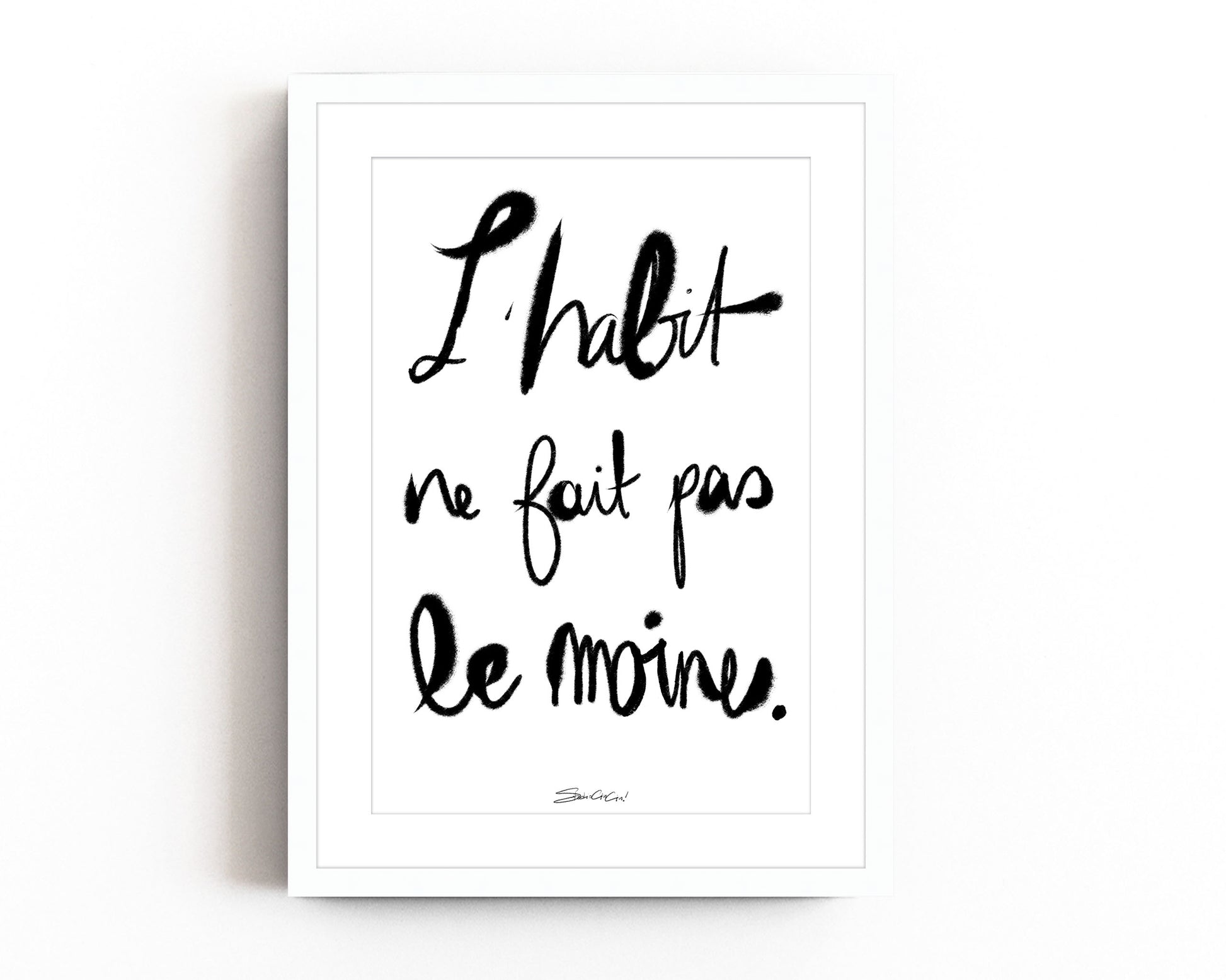 French typography print with “L’habit ne fait pas le moine” phrase in modern calligraphy style, black and white minimalist wall art.