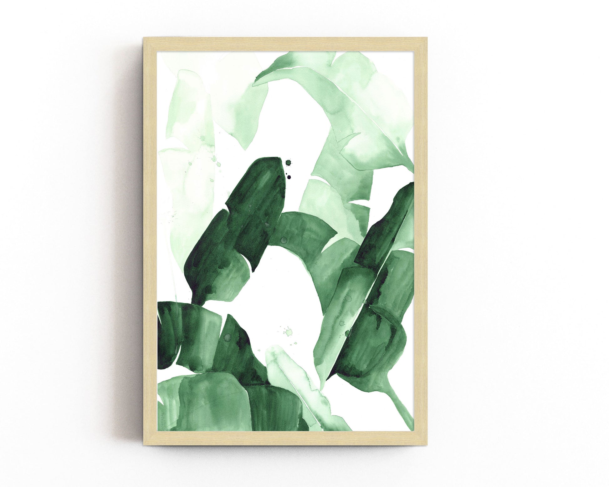 Abstract watercolor painting of tropical banana leaves in varying shades of green, featuring bold brushstrokes and layered textures, framed in blac