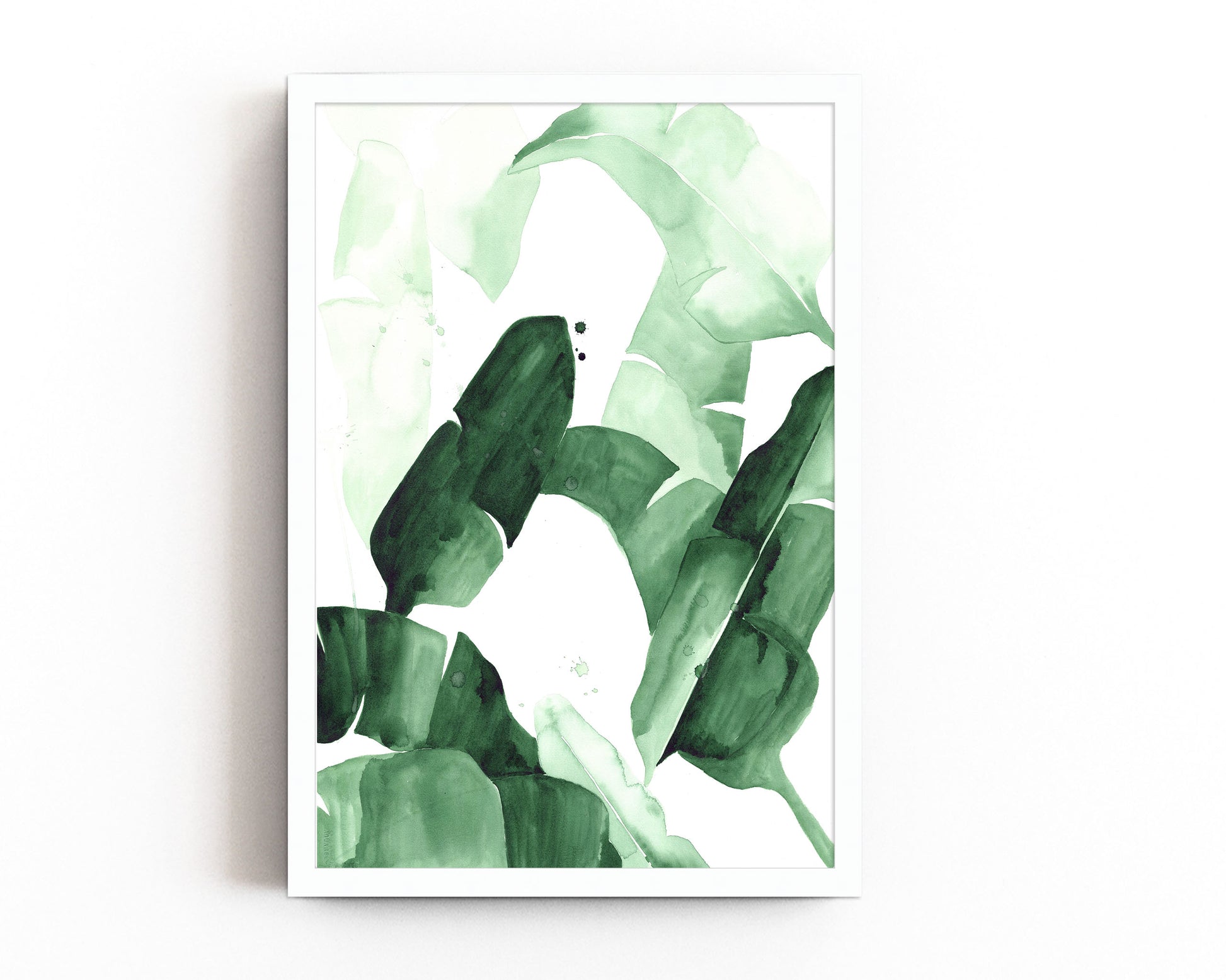 Abstract watercolor painting of tropical banana leaves in varying shades of green, featuring bold brushstrokes and layered textures, framed in blac