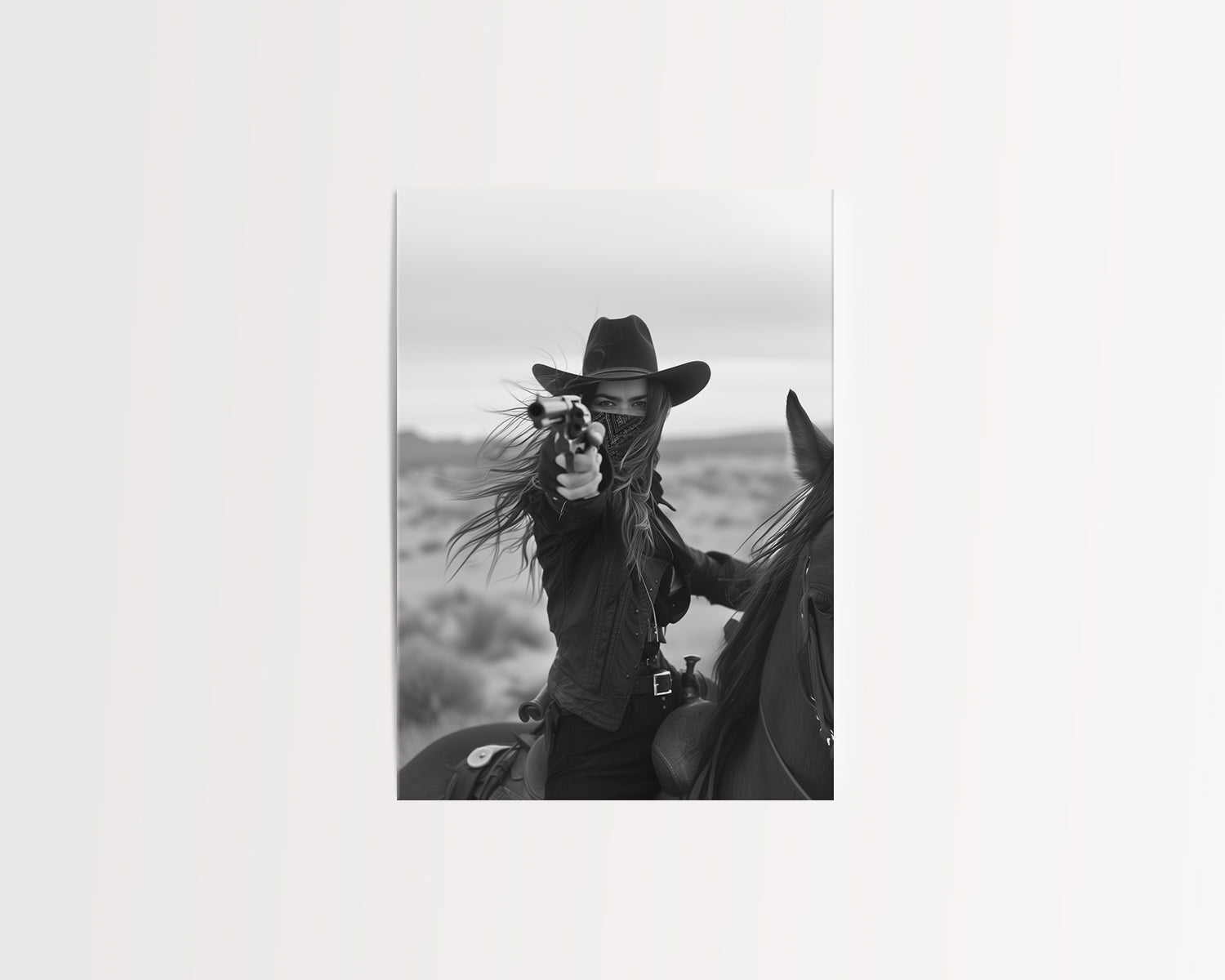 Black and white photograph of a female cowboy riding a horse, wearing a hat and bandana, aiming a revolver directly at the camera. The image captures a powerful, dramatic moment with a Western theme.