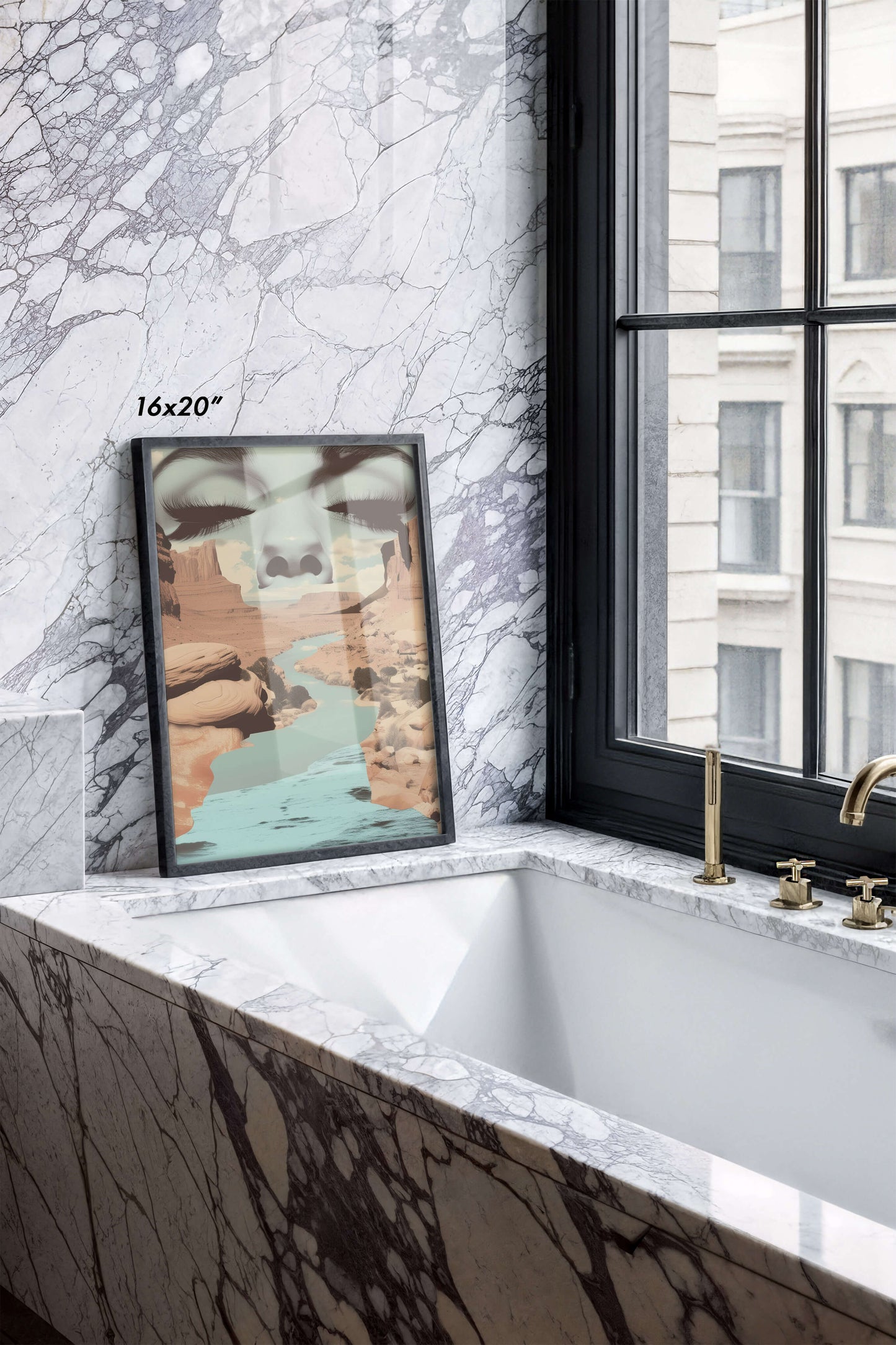 A framed abstract landscape art print leaning against a white marble wall in a modern bathroom setting with a bathtub and window.