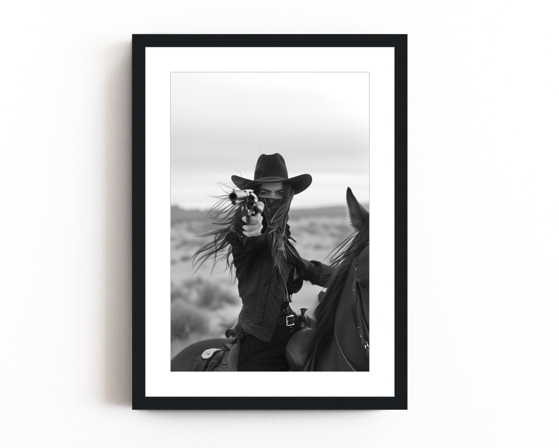 Black and white photograph of a female cowboy riding a horse, wearing a hat and bandana, aiming a revolver directly at the camera. The image captures a powerful, dramatic moment with a Western theme.