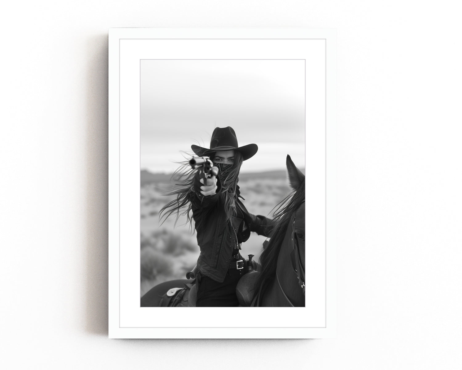 Black and white photograph of a female cowboy riding a horse, wearing a hat and bandana, aiming a revolver directly at the camera. The image captures a powerful, dramatic moment with a Western theme.