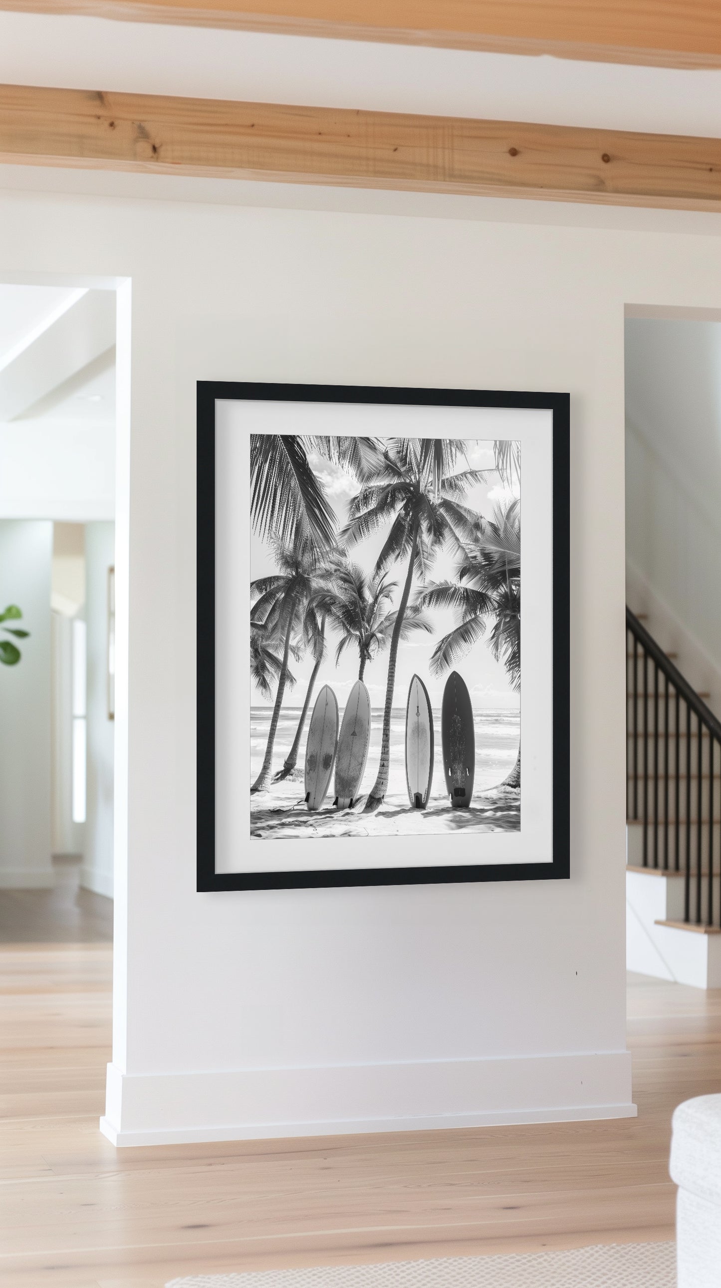 Black and white coastal wall art featuring surfboards lined up against palm trees on a tropical beach, capturing the vintage beach photography style and minimalist coastal decor.