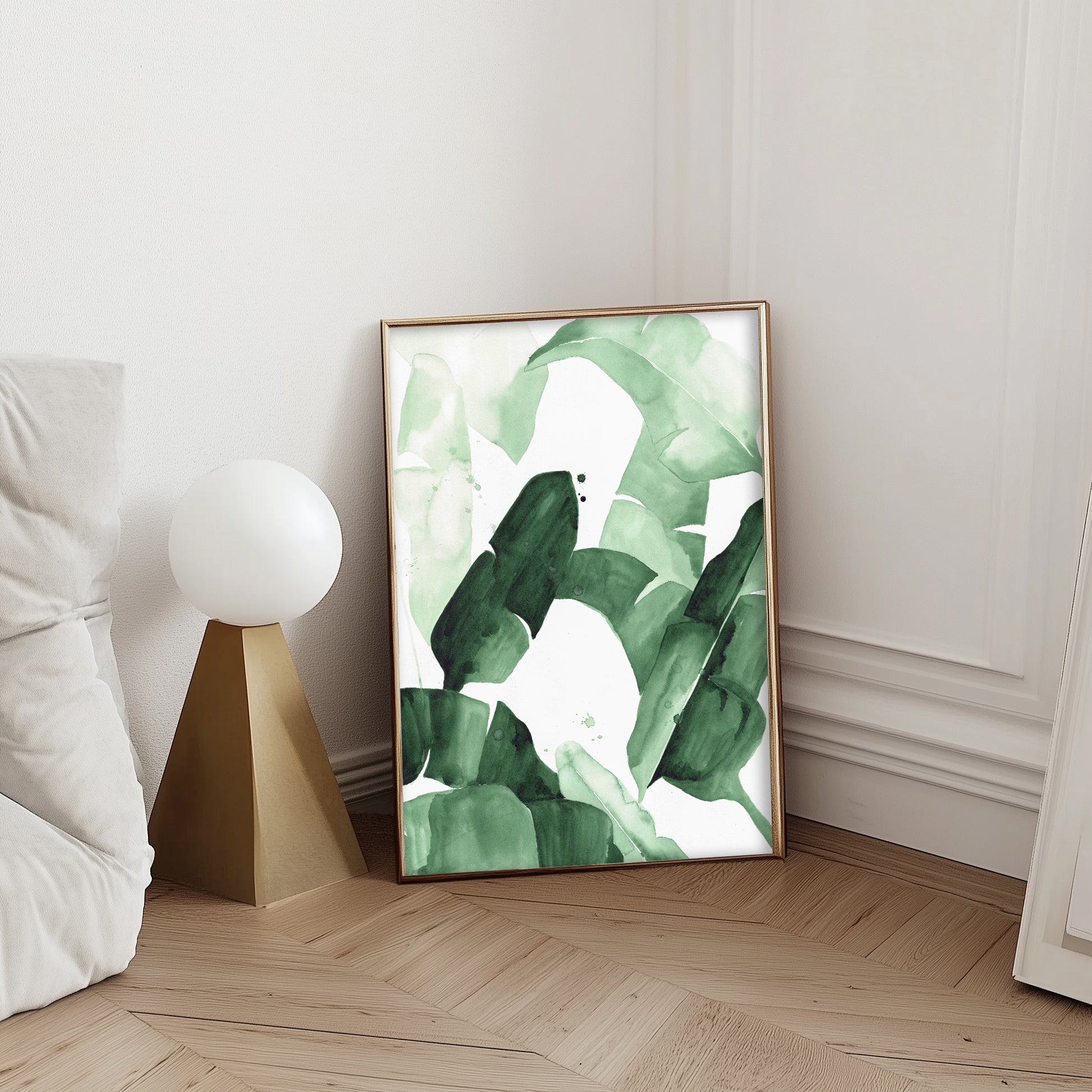 Abstract watercolor painting of tropical banana leaves in varying shades of green, featuring bold brushstrokes and layered textures, framed in blac