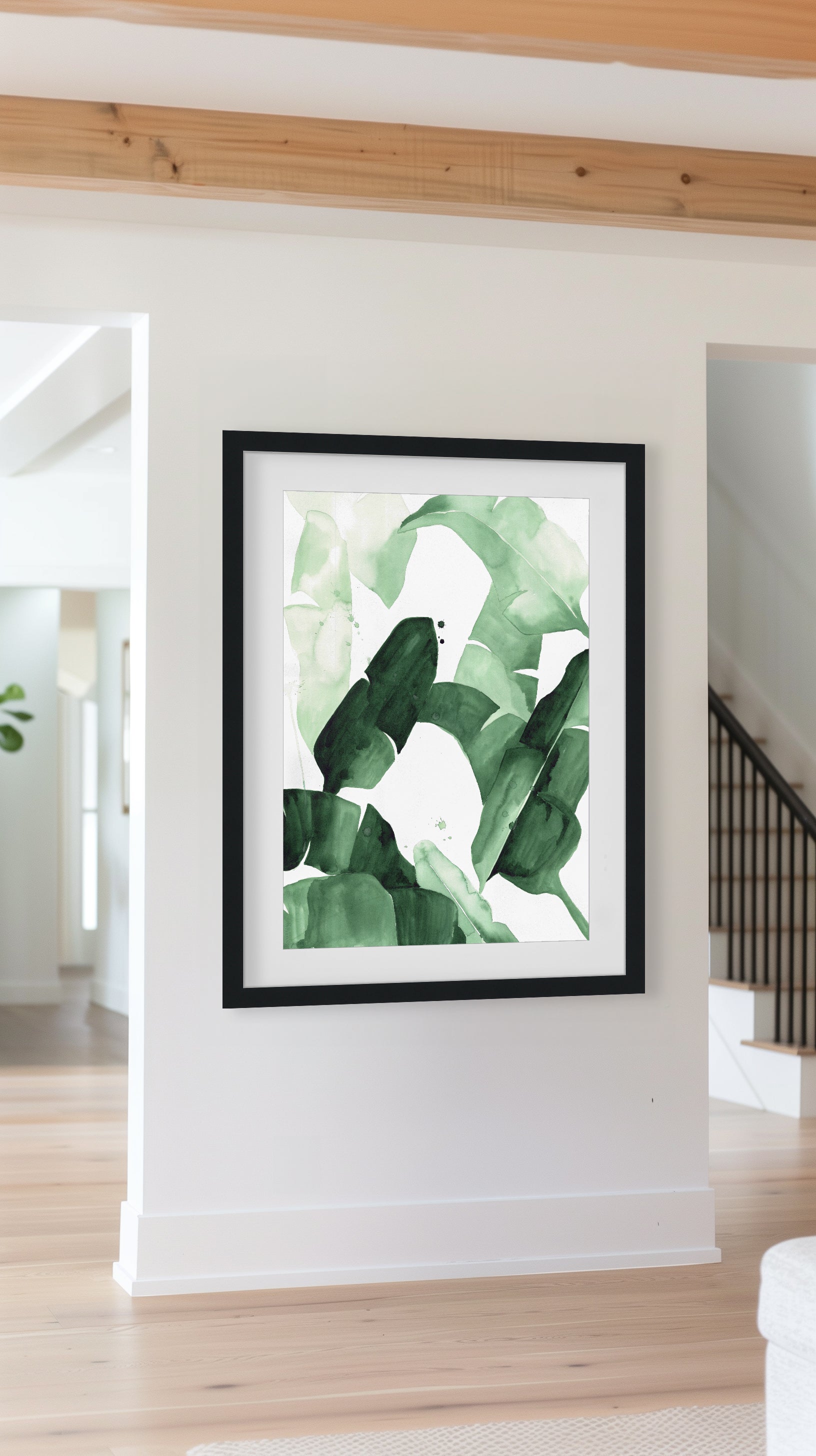 Abstract watercolor painting of tropical banana leaves in varying shades of green, featuring bold brushstrokes and layered textures, framed in blac