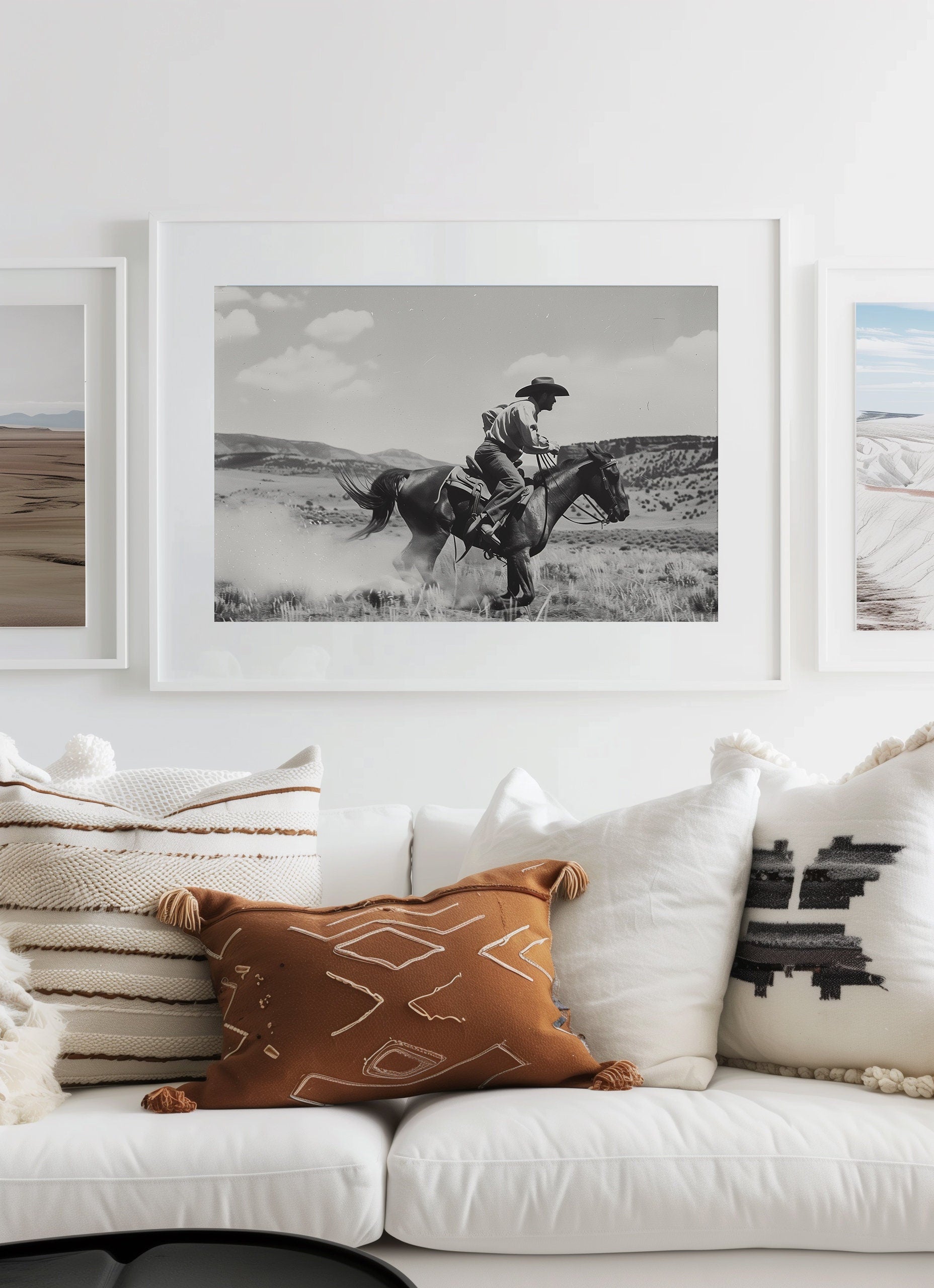 Black and white photography art featuring a cowboy riding a horse in a Western landscape, capturing the dynamic motion and timeless spirit of the Old West.