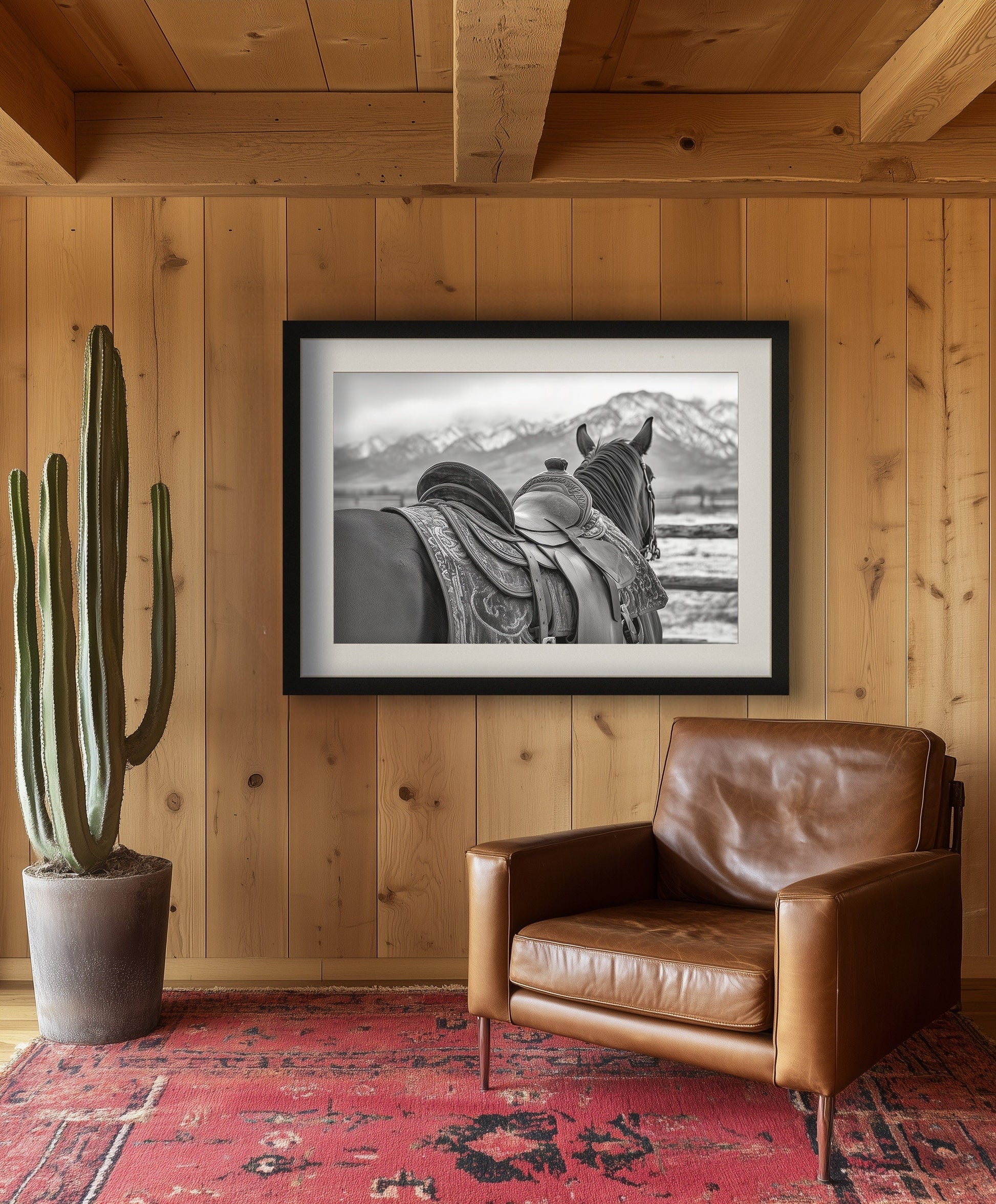 Black and white horse photography print featuring a horse with a detailed western saddle, set against a mountain landscape. Ideal for rustic equestrian decor and western-inspired art.