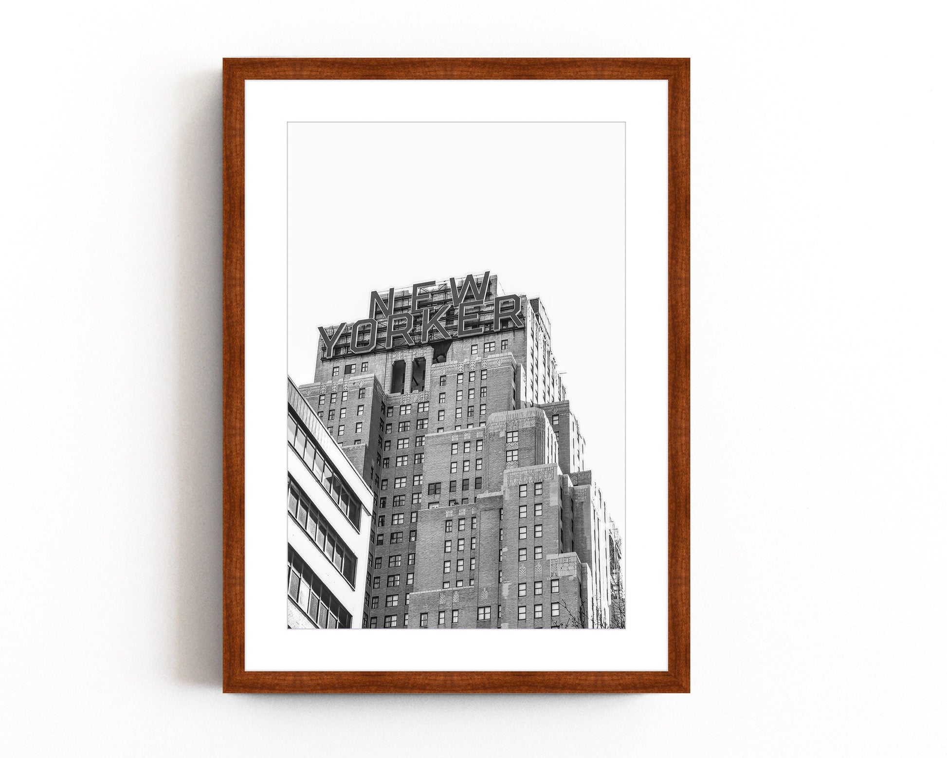 A black and white print of the New Yorker building, featuring its iconic typography and classic New York architecture, perfect for cityscape and urban decor.