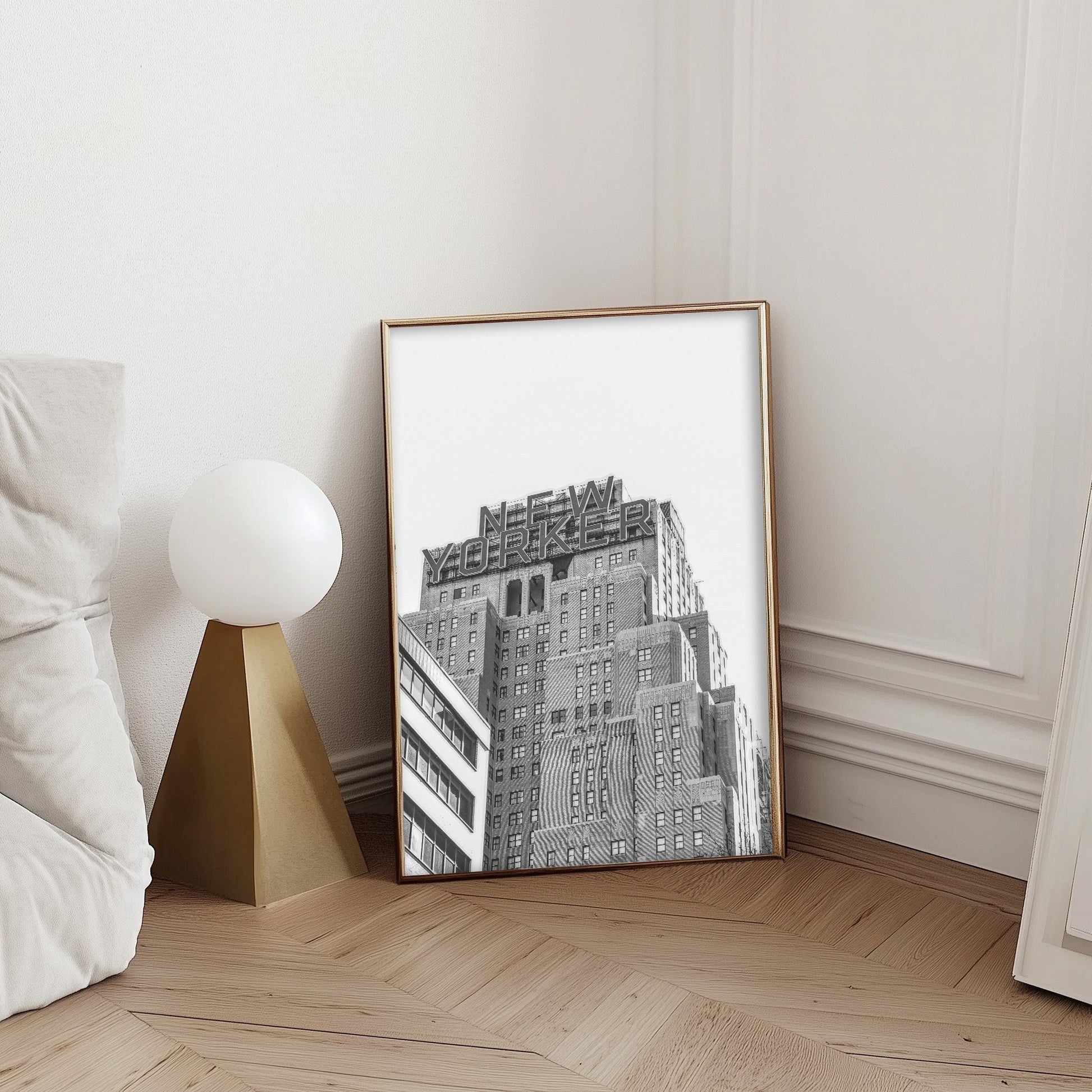 Black and white art print of the iconic New Yorker building in Manhattan, showcasing urban skyscraper architecture with a vintage cityscape feel.