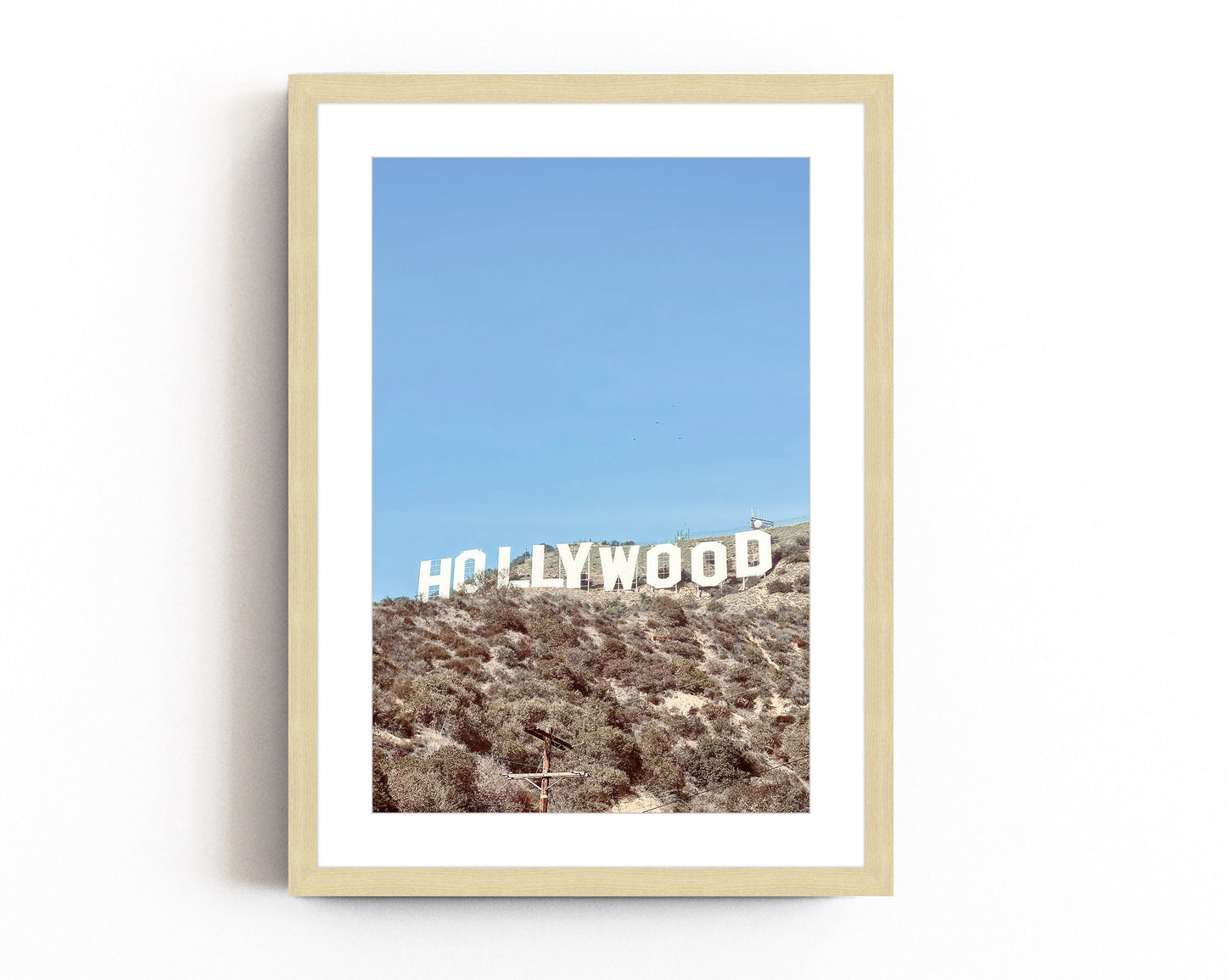 Iconic Hollywood sign photography print featuring the famous California landmark against the backdrop of the Hollywood hills.