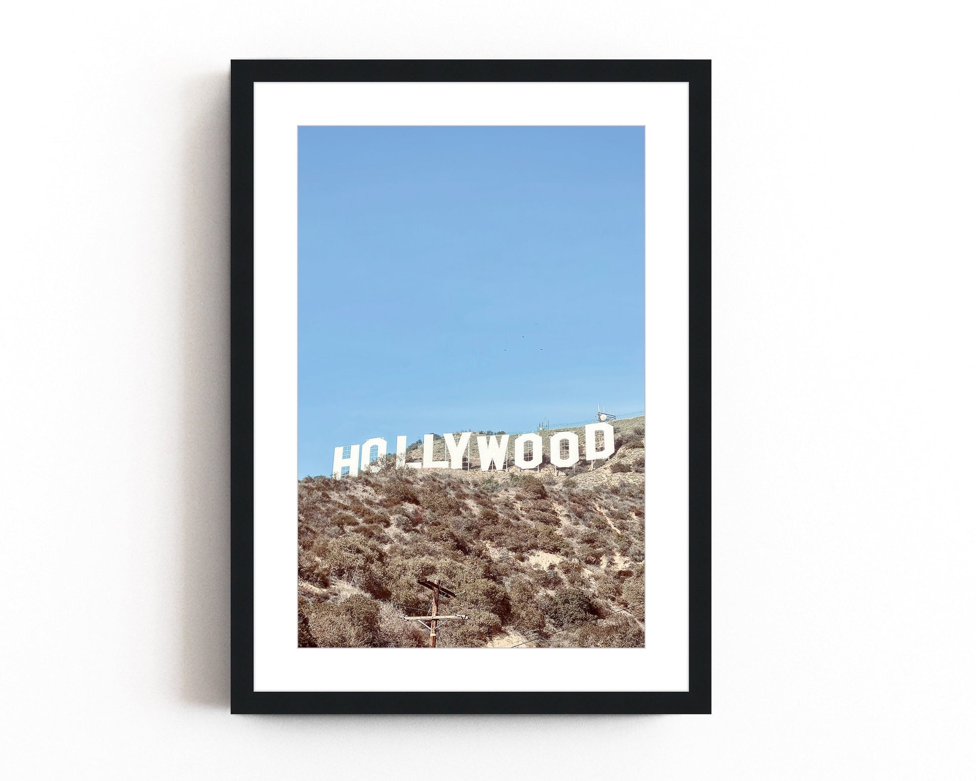 Iconic Hollywood sign photography print featuring the famous California landmark against the backdrop of the Hollywood hills.