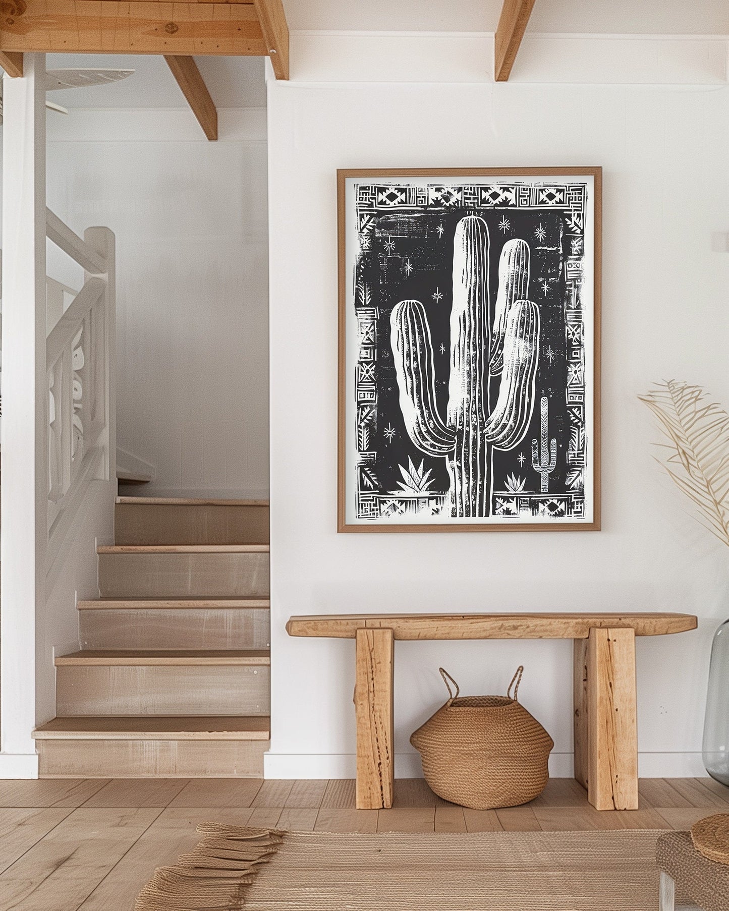 Black and white cactus art print with tribal border, perfect for boho and southwestern-inspired decor, showcasing bold desert design elements.