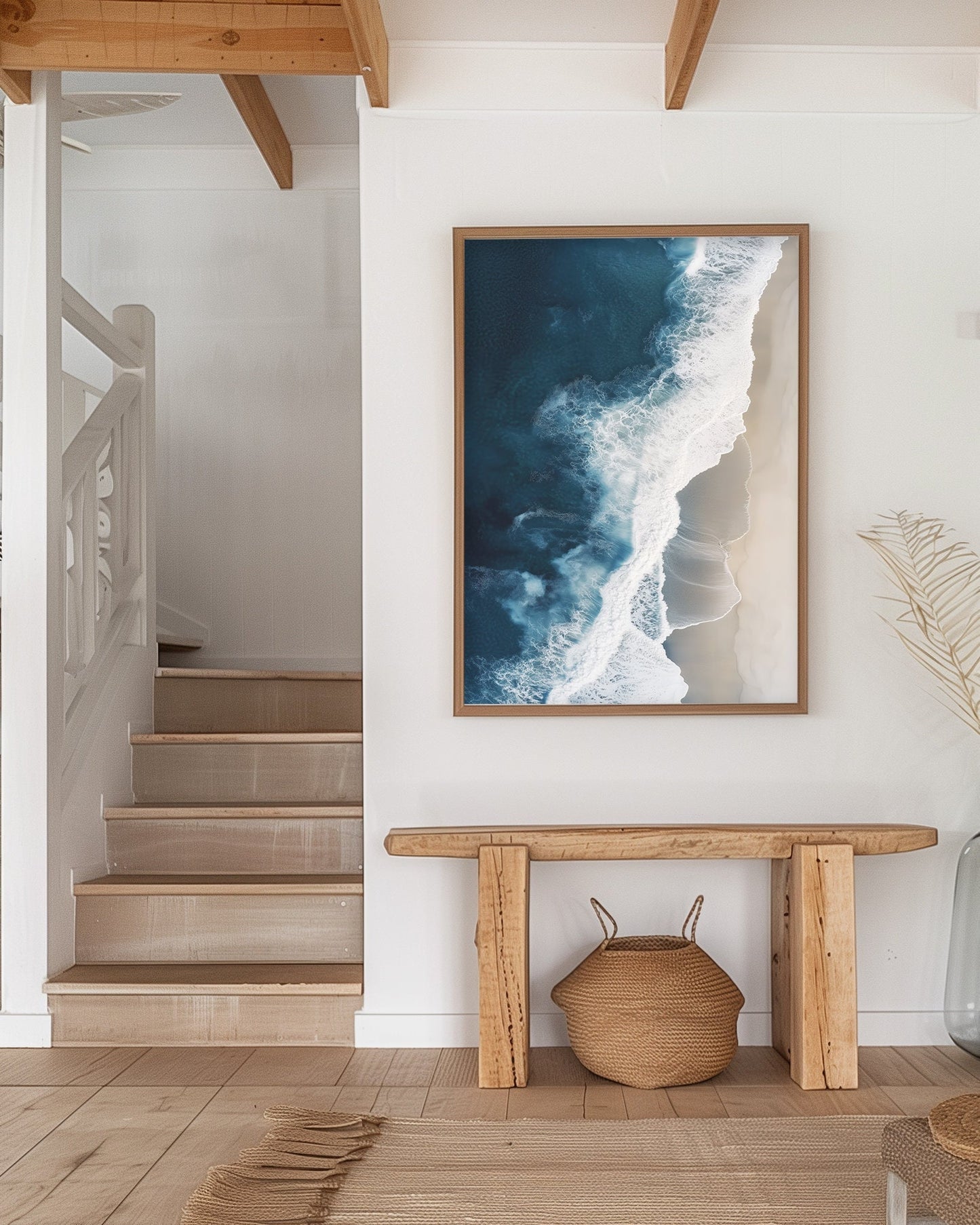 Aerial view of ocean waves crashing onto a sandy beach, showcasing deep blue waters and minimalist coastal scenery, perfect for modern beach home decor.