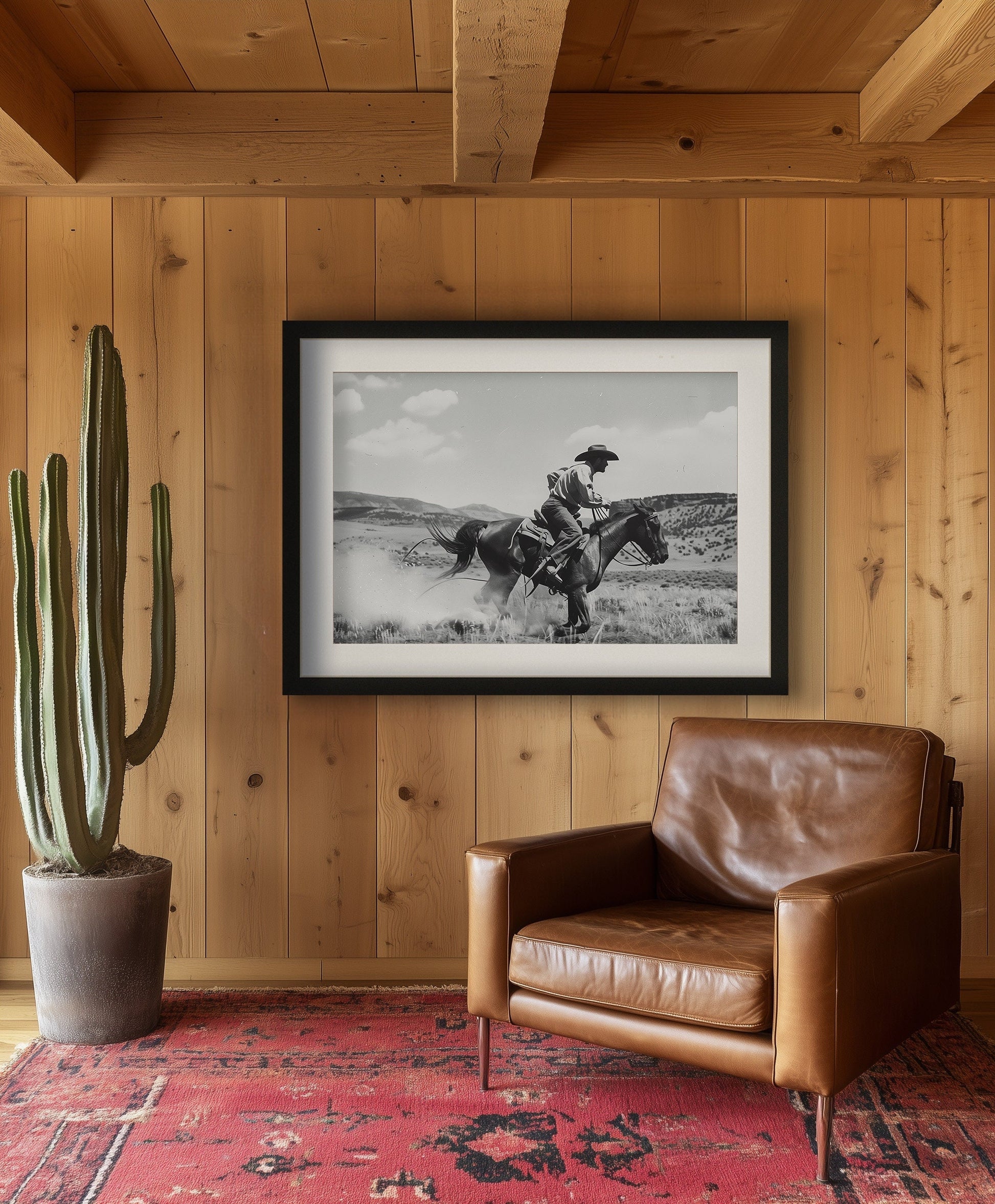 Black and white photography art featuring a cowboy riding a horse in a Western landscape, capturing the dynamic motion and timeless spirit of the Old West.