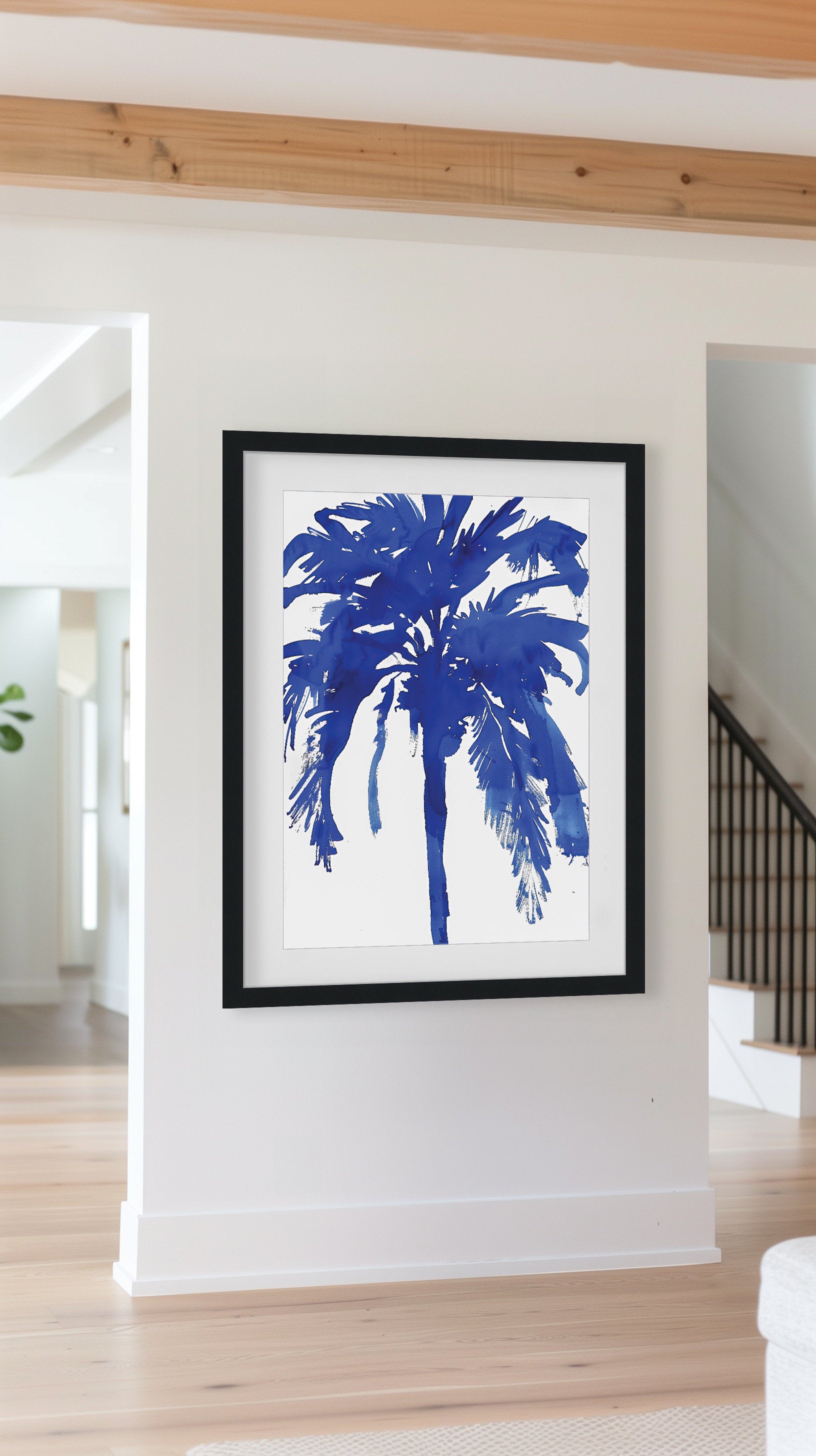 Bold blue abstract palm tree art print with minimalist design, featuring a deep navy silhouette of a palm tree on a white background. Perfect for modern coastal or tropical-inspired decor.