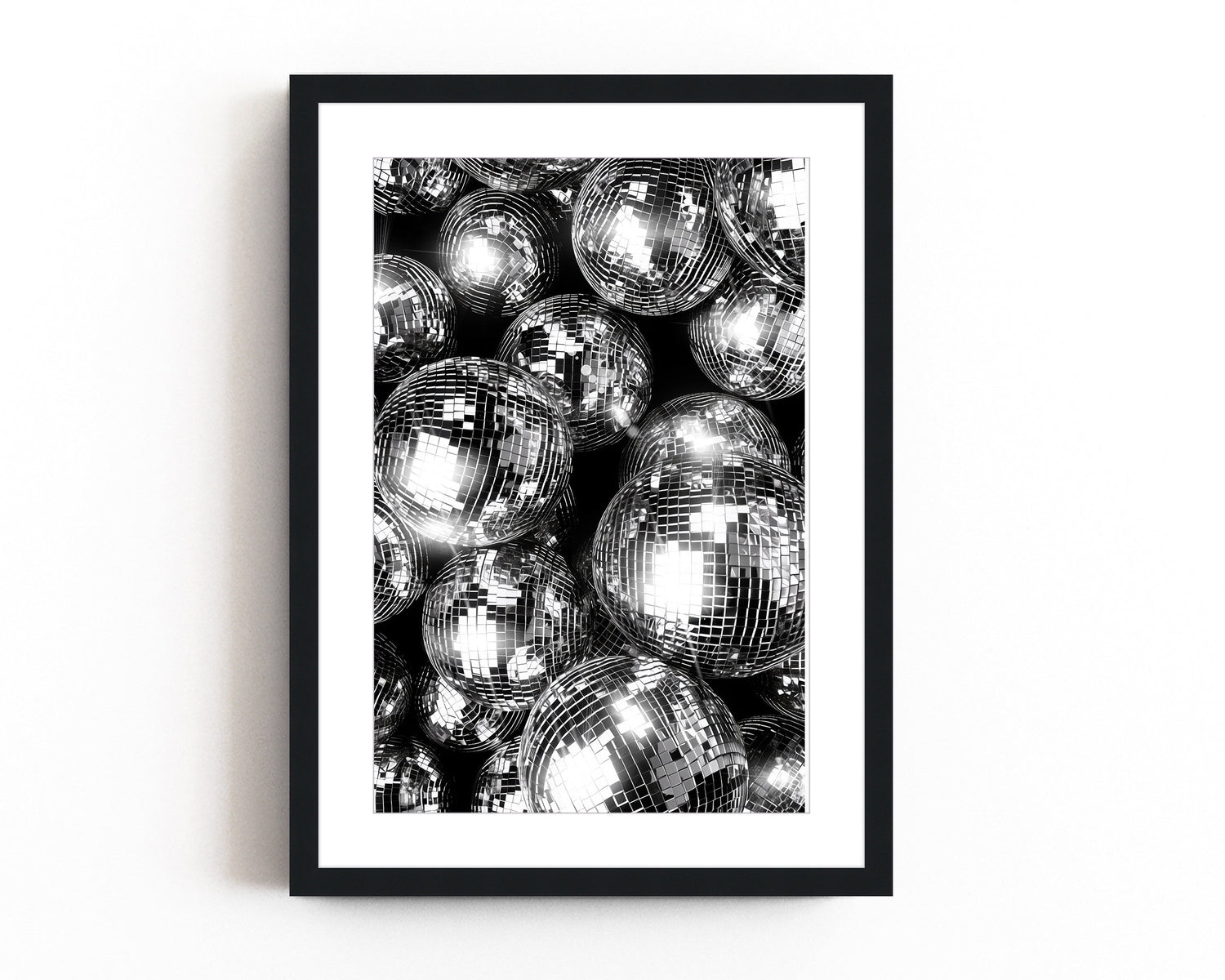  Black and silver disco ball wall art featuring reflective spheres with intricate details, creating a bold and glamorous modern decor statement.