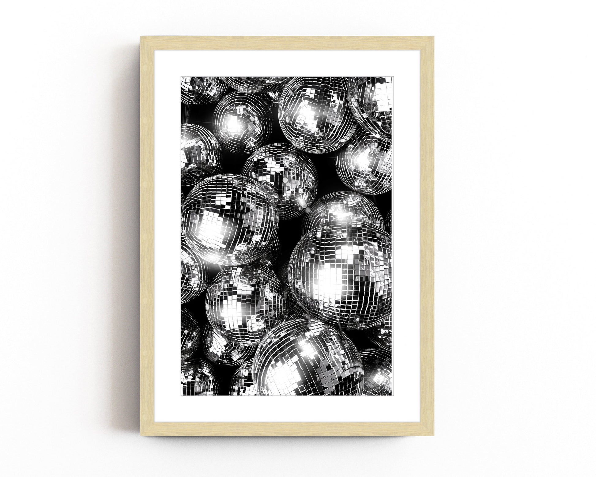  Black and silver disco ball wall art featuring reflective spheres with intricate details, creating a bold and glamorous modern decor statement.