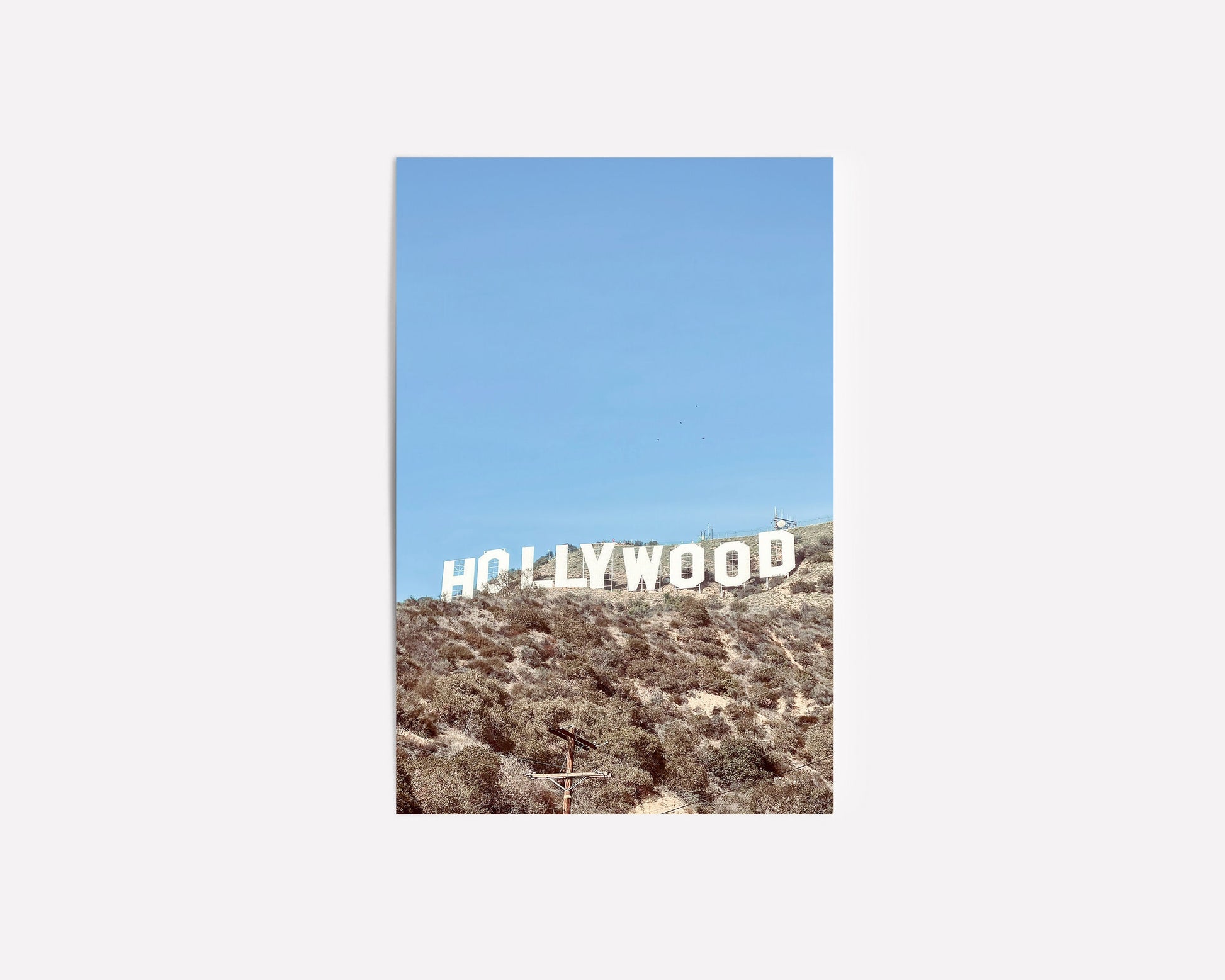 Iconic Hollywood sign photography print featuring the famous California landmark against the backdrop of the Hollywood hills.