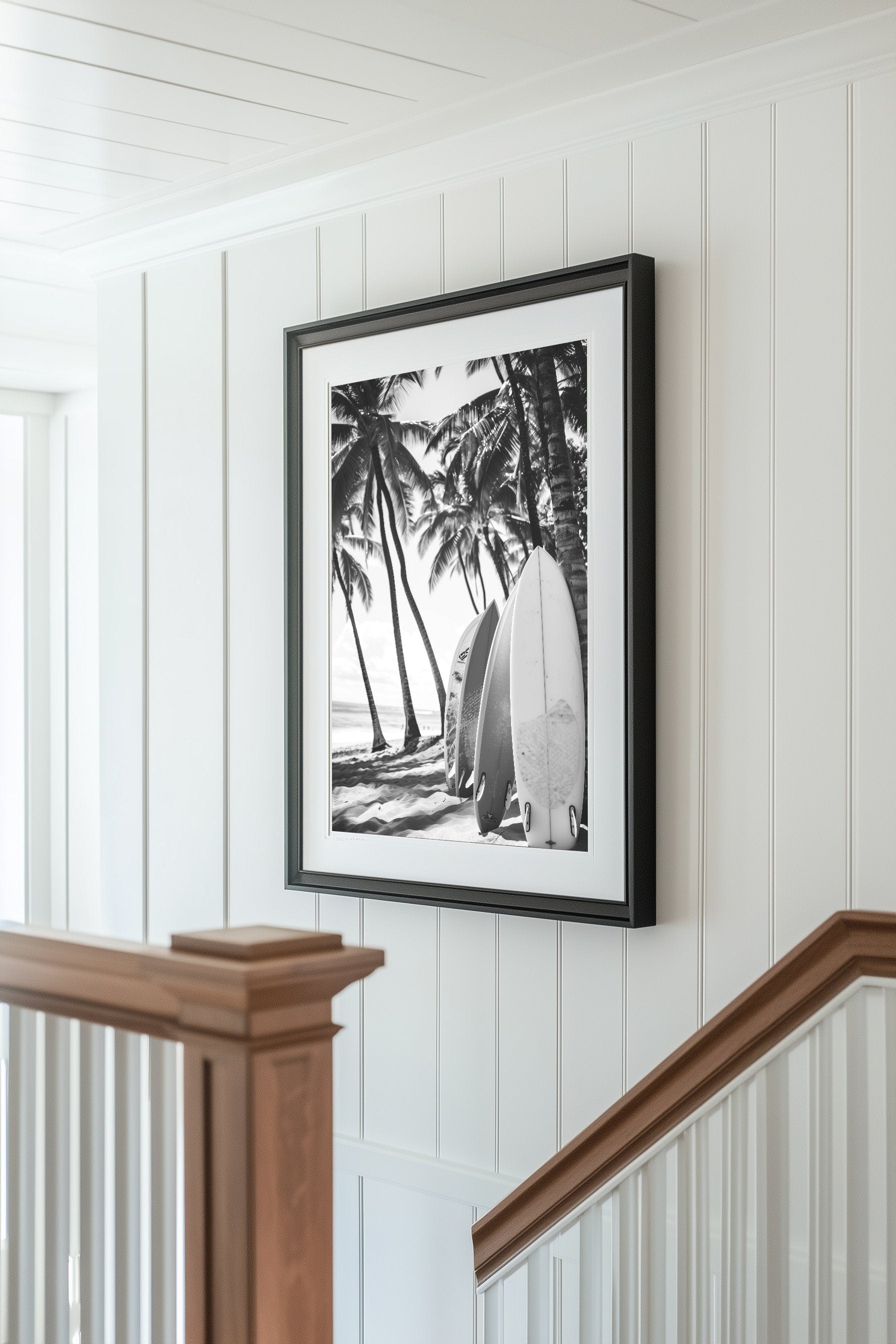 Black and white surfboard art print featuring surfboards resting on a beach under palm trees, capturing the essence of coastal living.
