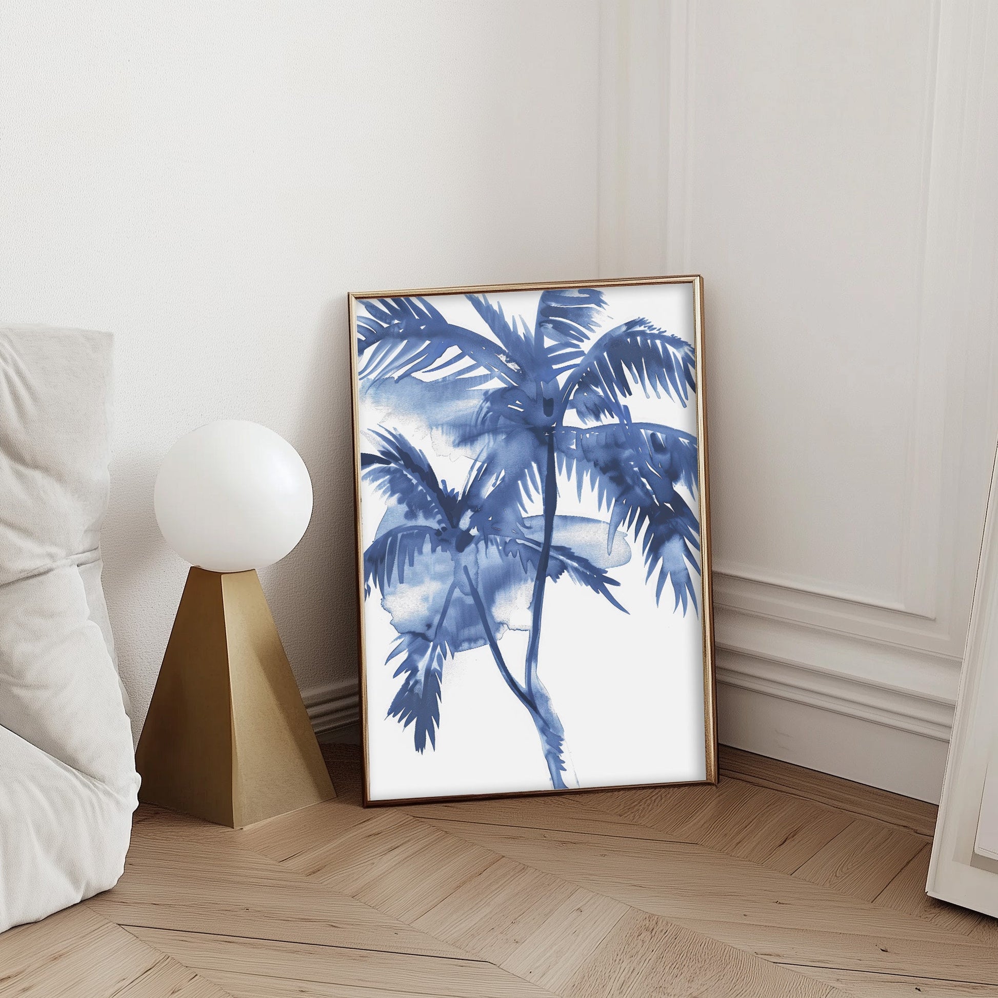 Blue watercolor palm tree print in a black frame, featuring vibrant tropical palms with a calming coastal feel.