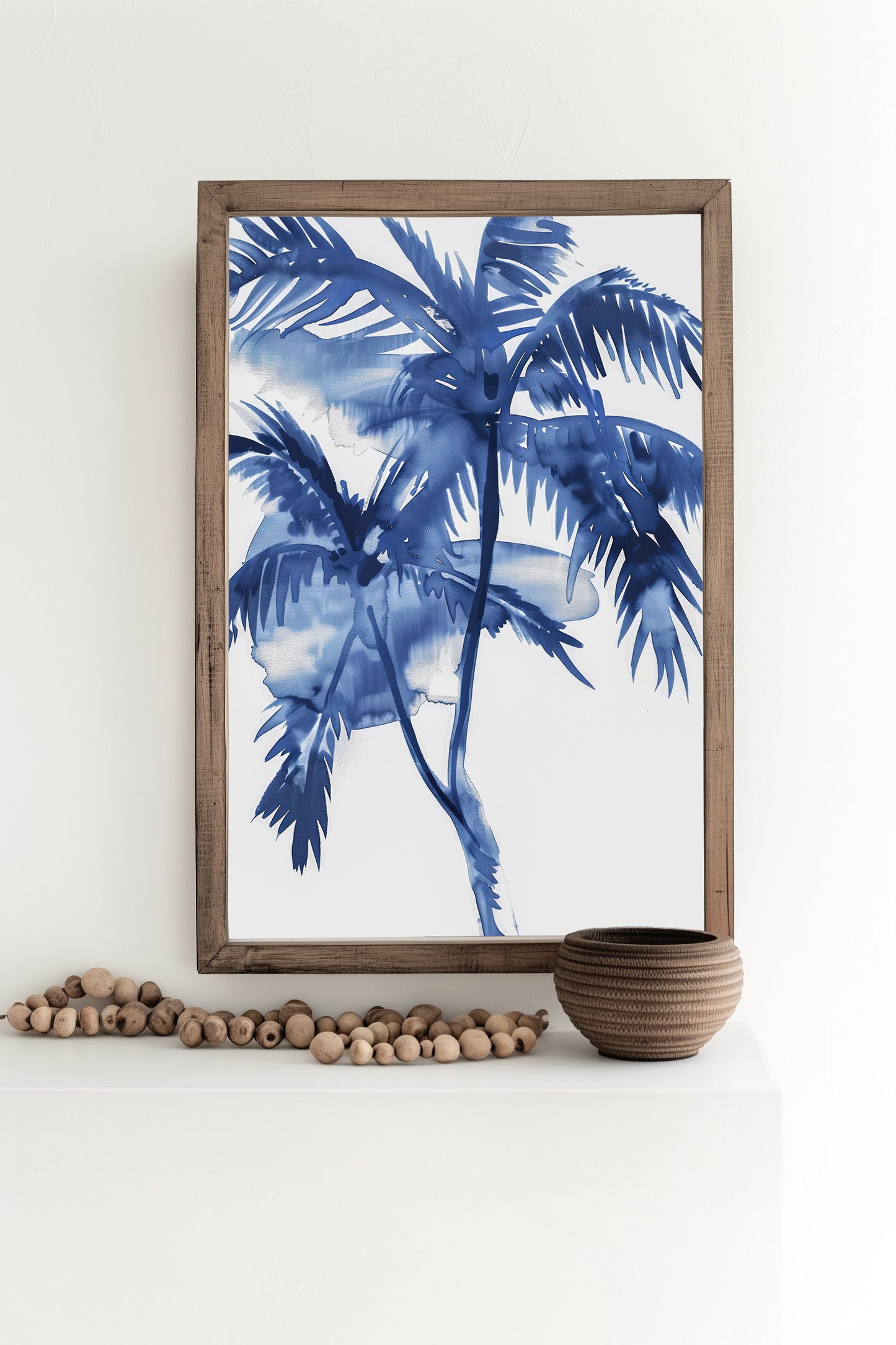 Blue watercolor palm tree print in a black frame, featuring vibrant tropical palms with a calming coastal feel.