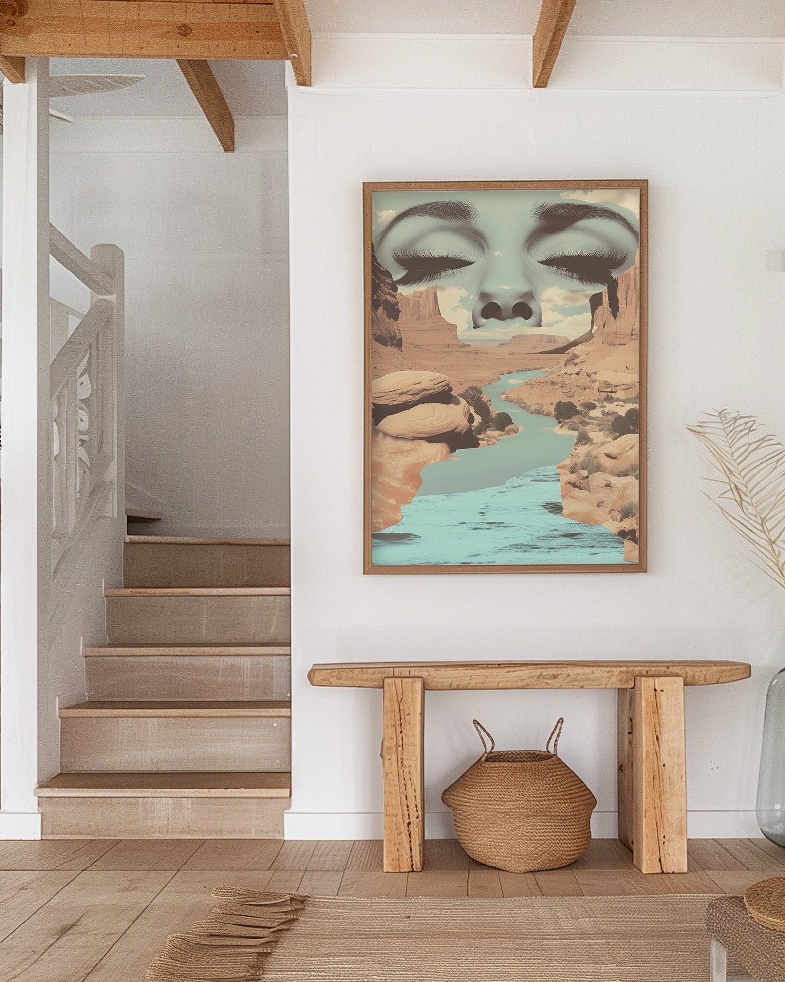 Surreal art print featuring a serene face merging with a desert canyon landscape and flowing river, blending nature and human elements in a dreamlike composition.