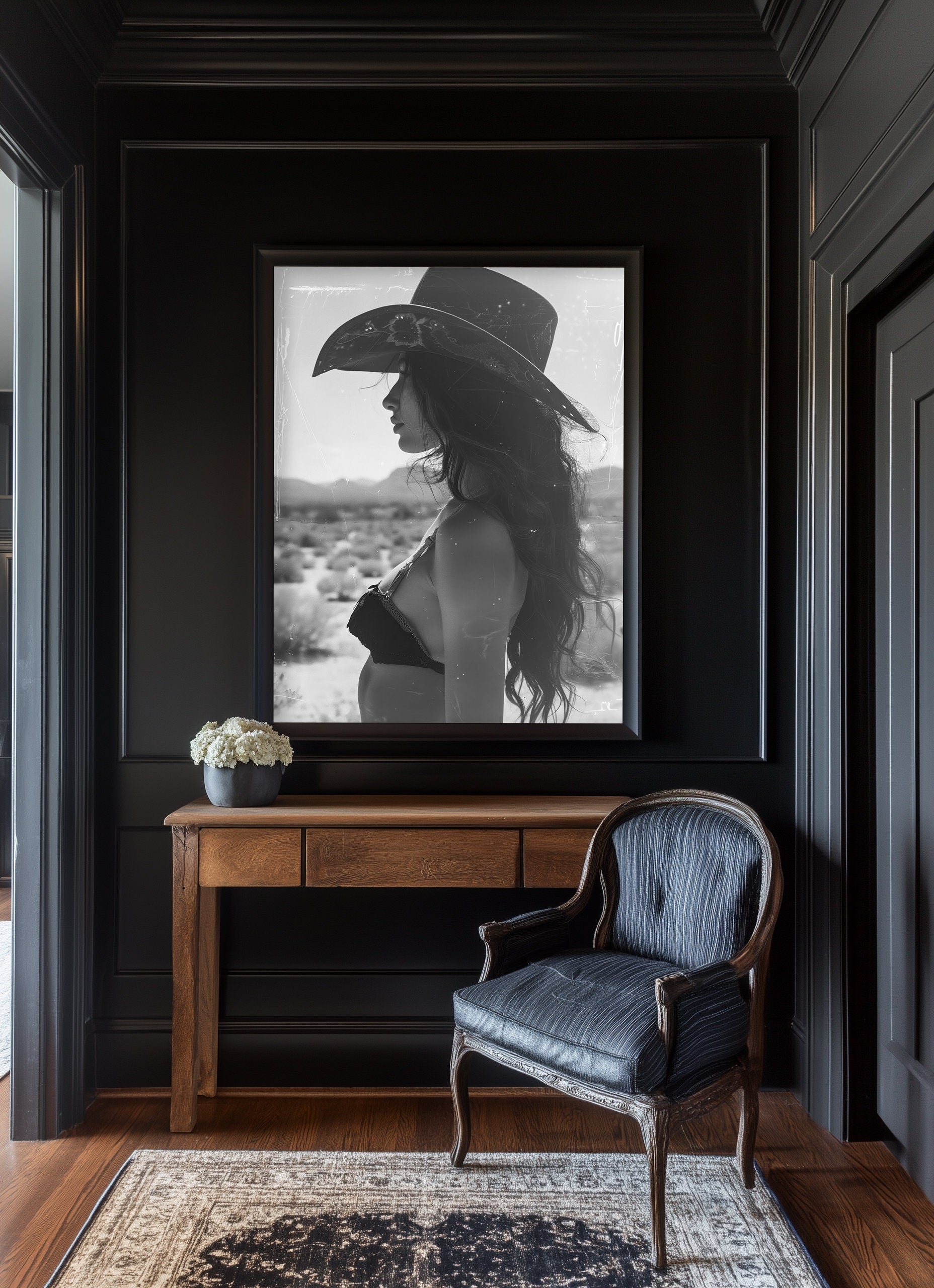 Black and white western cowgirl portrait with vintage film marks and scratches, evoking a southwestern desert vibe with retro photography style.