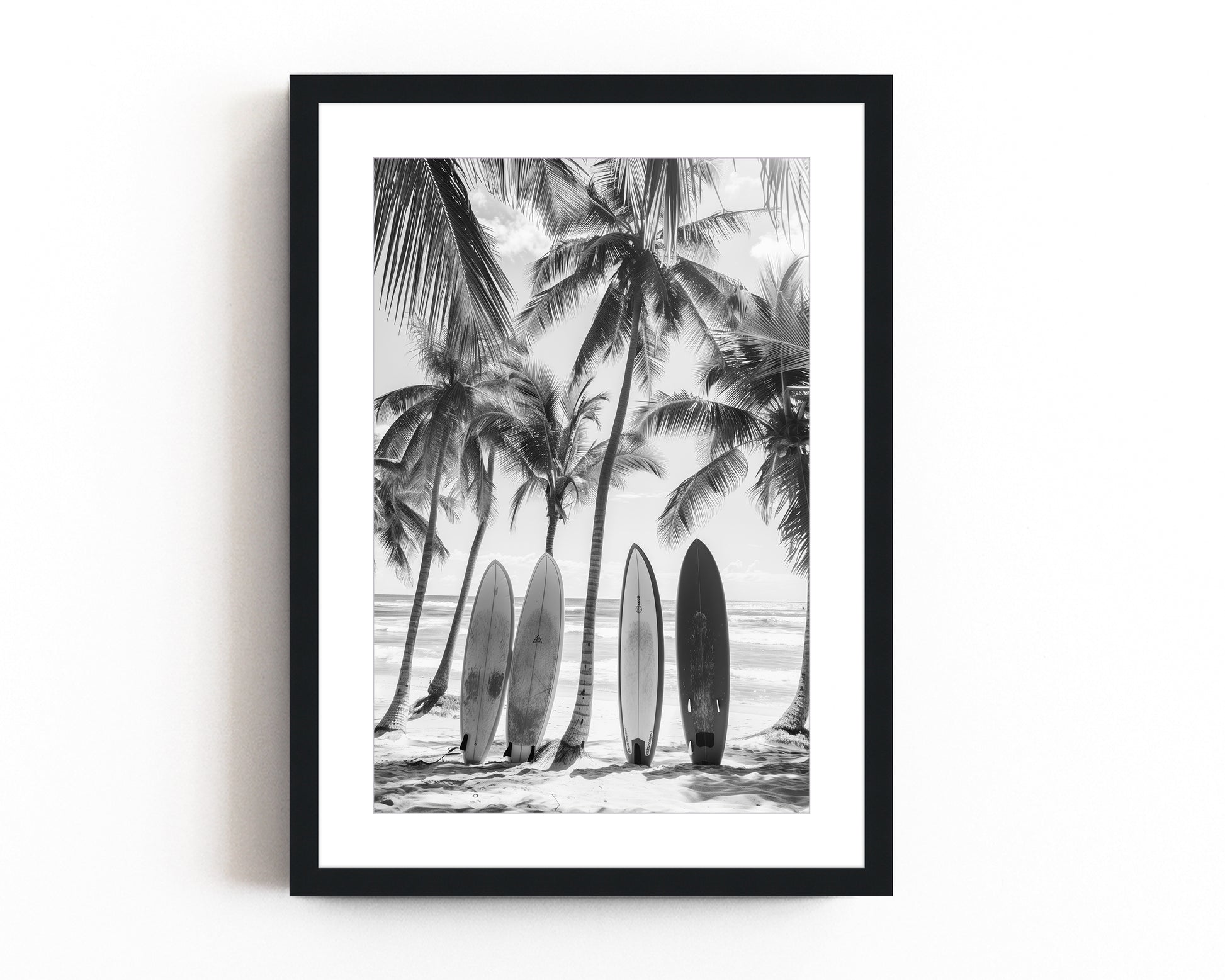 Black and white coastal wall art featuring surfboards lined up against palm trees on a tropical beach, capturing the vintage beach photography style and minimalist coastal decor.