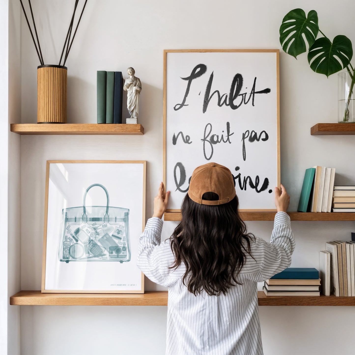 Airport X-ray inspired wall art featuring a transparent carry-on tote with a flip phone, instant camera, makeup, hotel key, and travel essentials in a monochrome fashion illustration style.